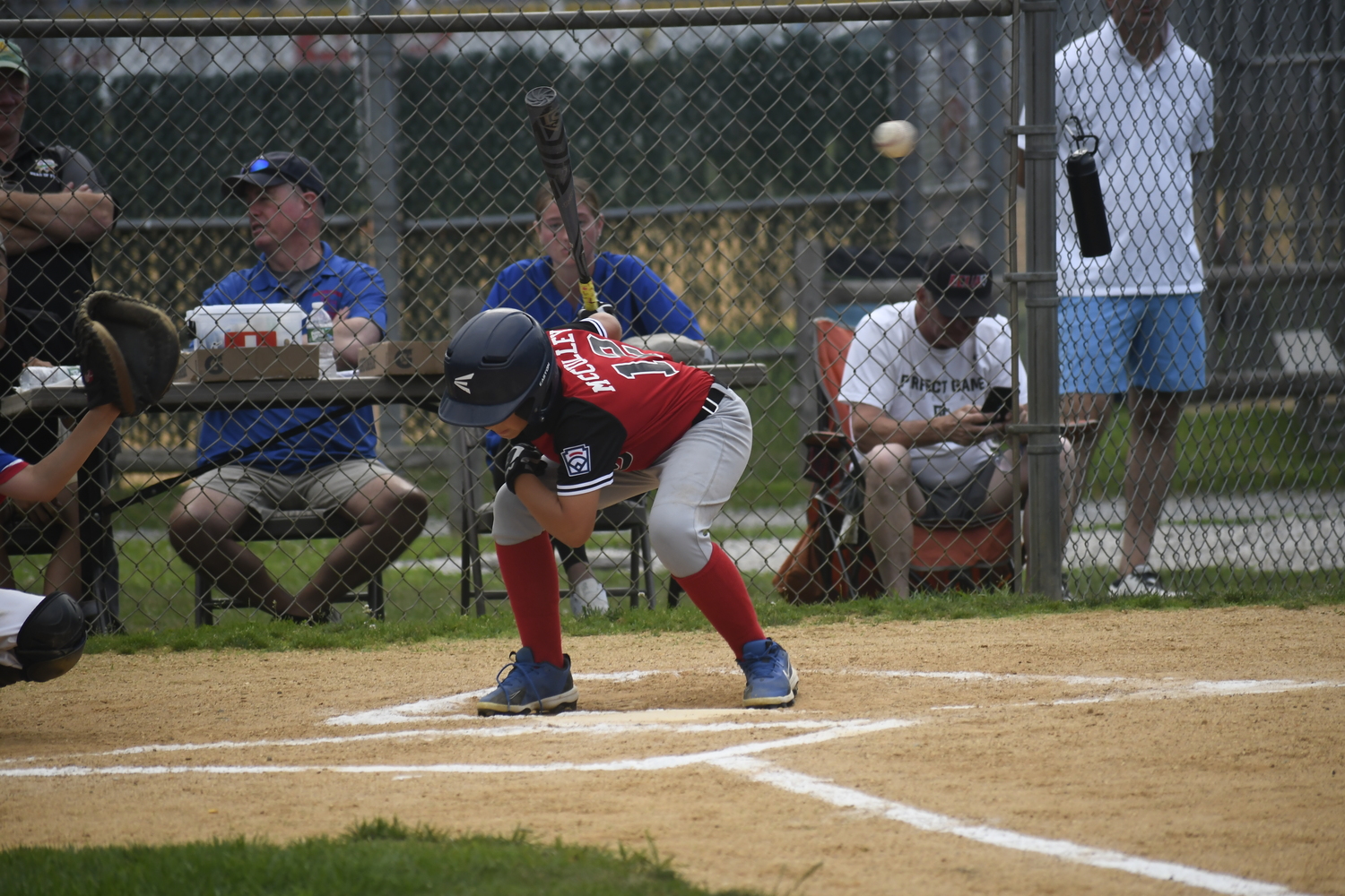 Owen McCulley ducks out of the way of an incoming high pitch.  DREW BUDD