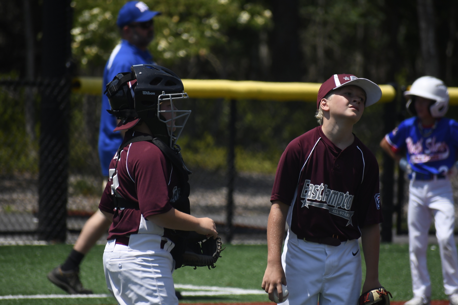 Catcher Ryder Abran tries to keep Colin Stone in the game.  DREW BUDD