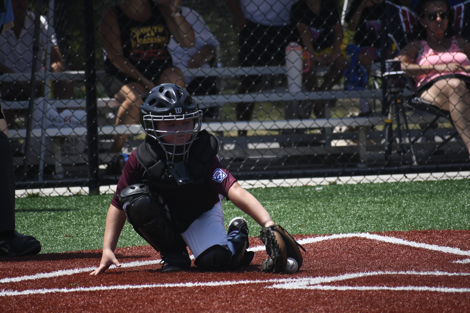Ryaer Abran with a backhand grab behind the plate.  DREW BUDD