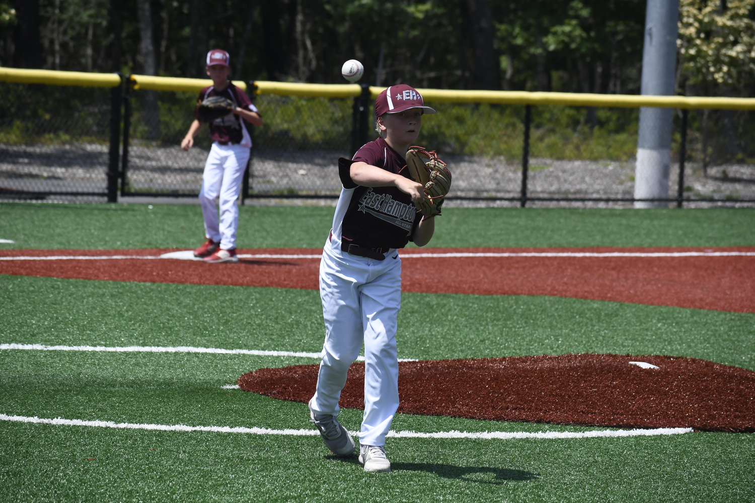 Colin Stone steps and fires to first base for an out.  DREW BUDD