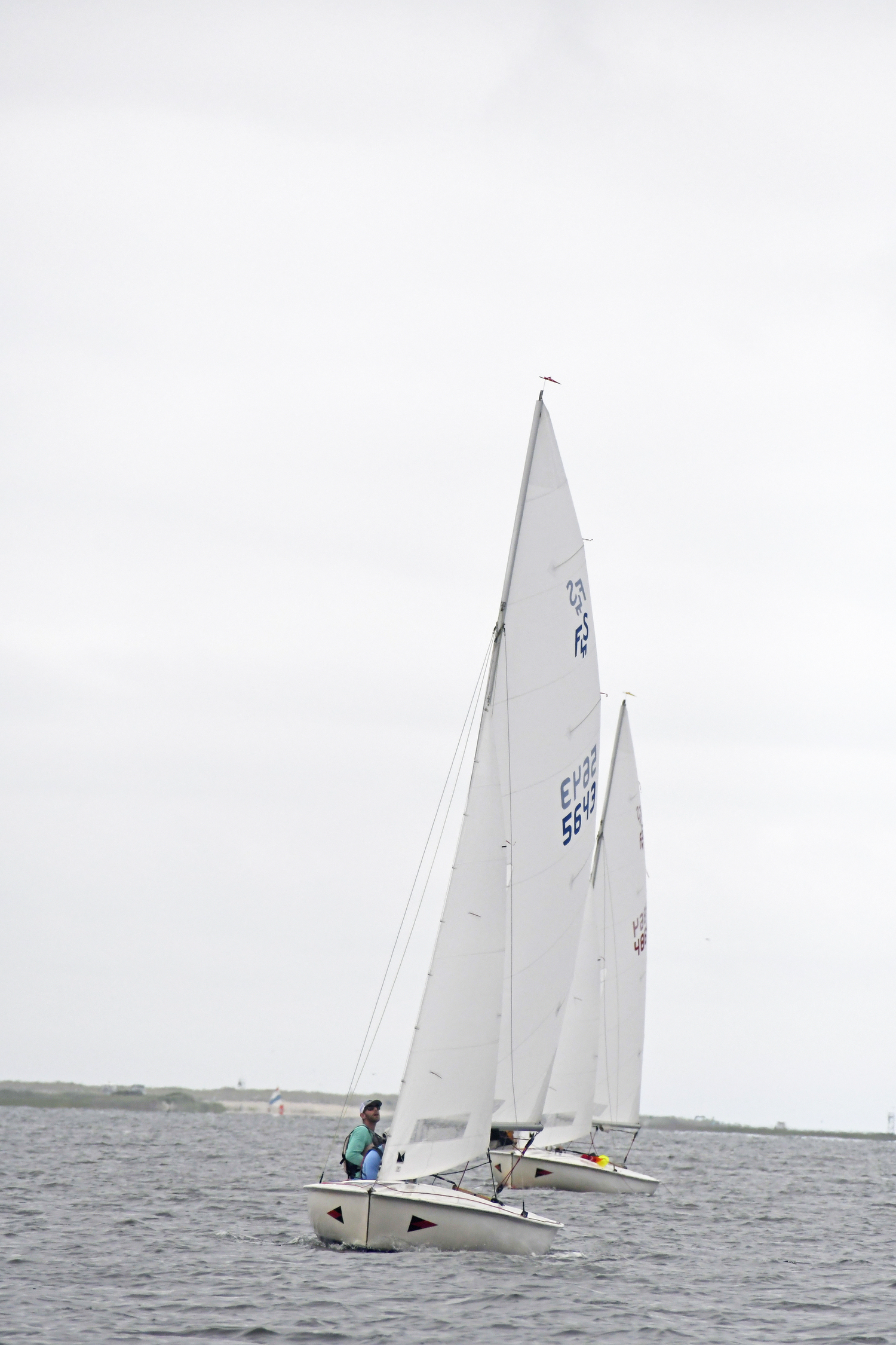 Luke Hickling checks out his sail after winning the second race.  DREW BUDD