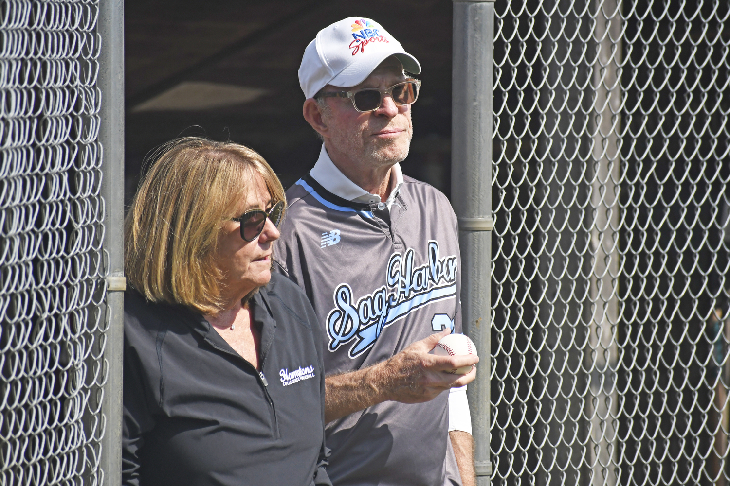 HCBL President Sandi Kruel leads out Michael Weisman out on to the field at Mashashimuet Park to throw out the first pitch.  DREW BUDD