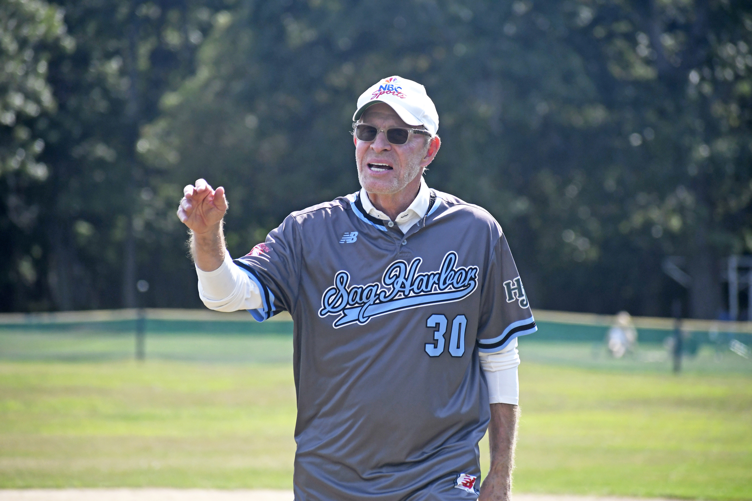 Michael Weisman waves to the crowd after throwing out the first pitch on Saturday afternoon. DREW BUDD