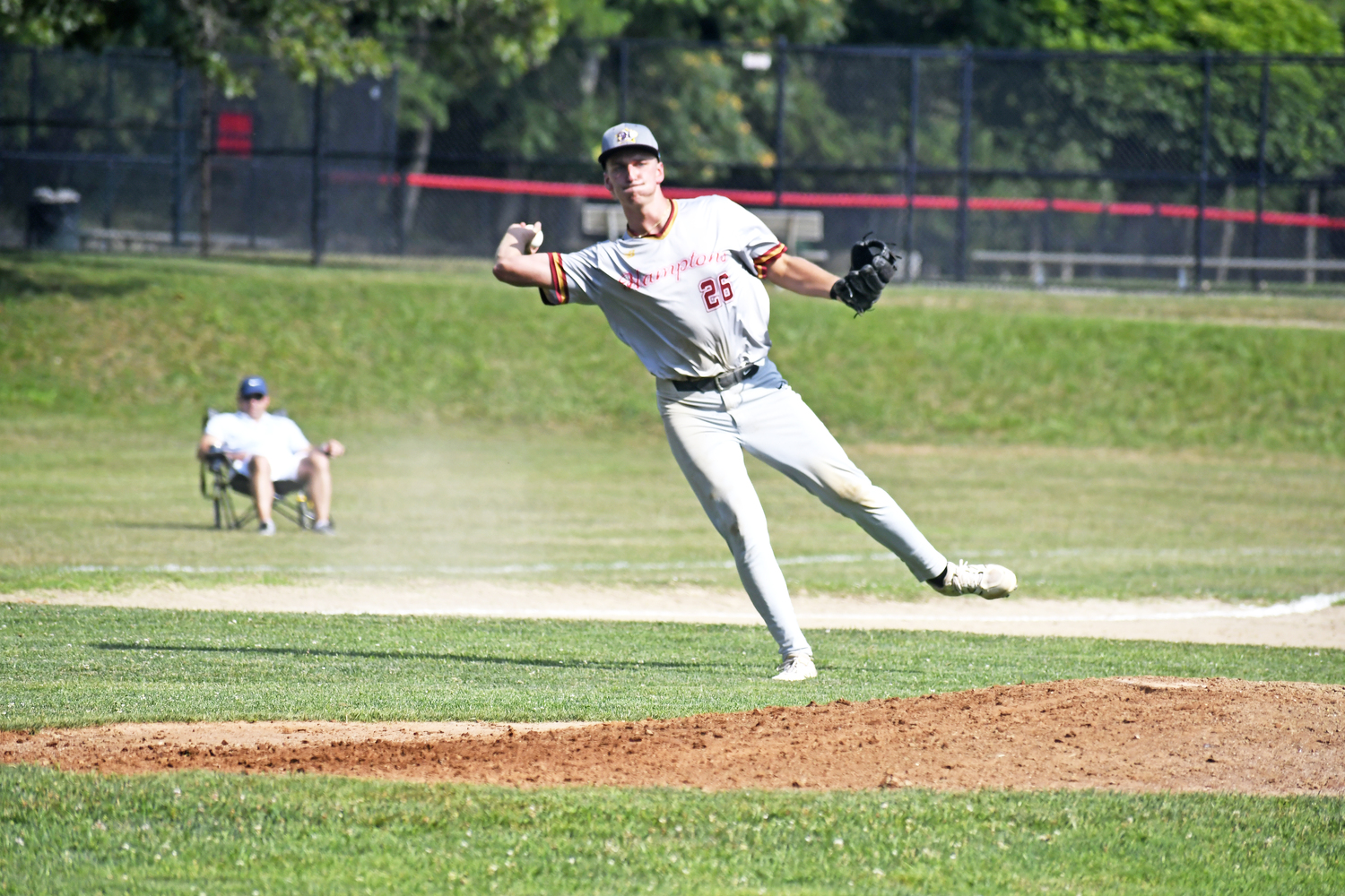 HCBL All-Star third baseman Alex Apicella (Southampton/Rowan) makes a nice play on a slow roller on the infield and a strong throw to first base.  DREW BUDD