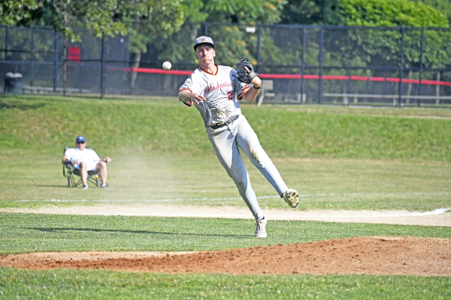 HCBL All-Star third baseman Alex Apicella (Southampton/Rowan) makes a nice play on a slow roller on the infield and a strong throw to first base.  DREW BUDD