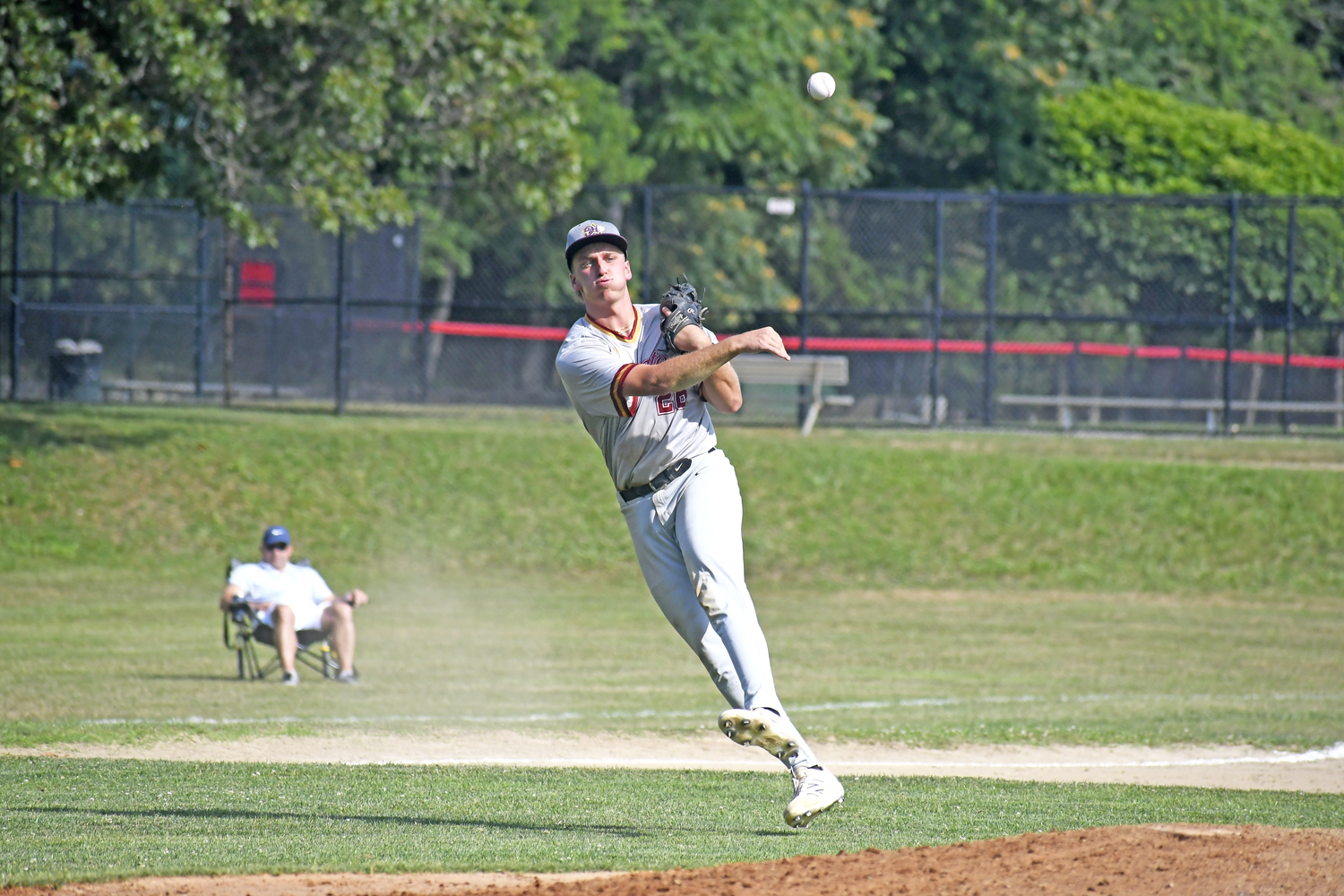 HCBL All-Star third baseman Alex Apicella (Southampton/Rowan) makes a nice play on a slow roller on the infield and a strong throw to first base.  DREW BUDD