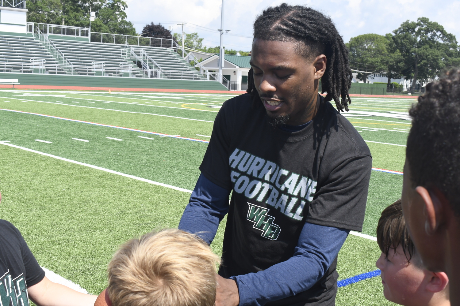 D.J. James signs his autograph.  DREW BUDD