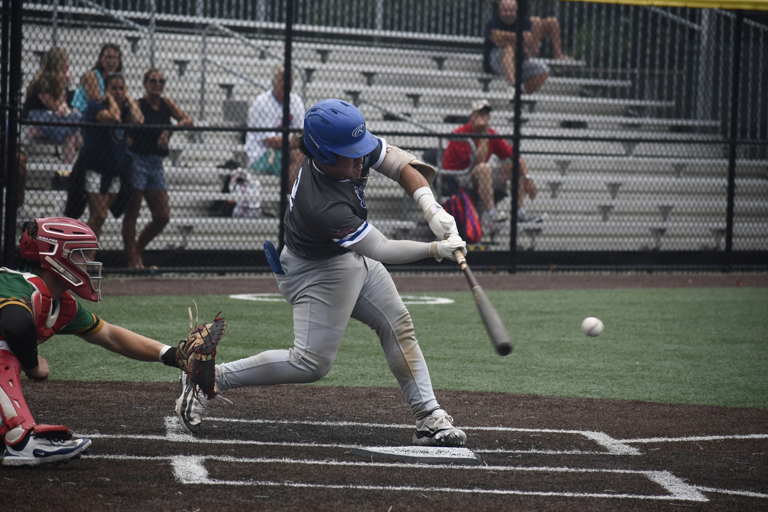 Derek Diaz (Le Moyne) makes contact.  DREW BUDD