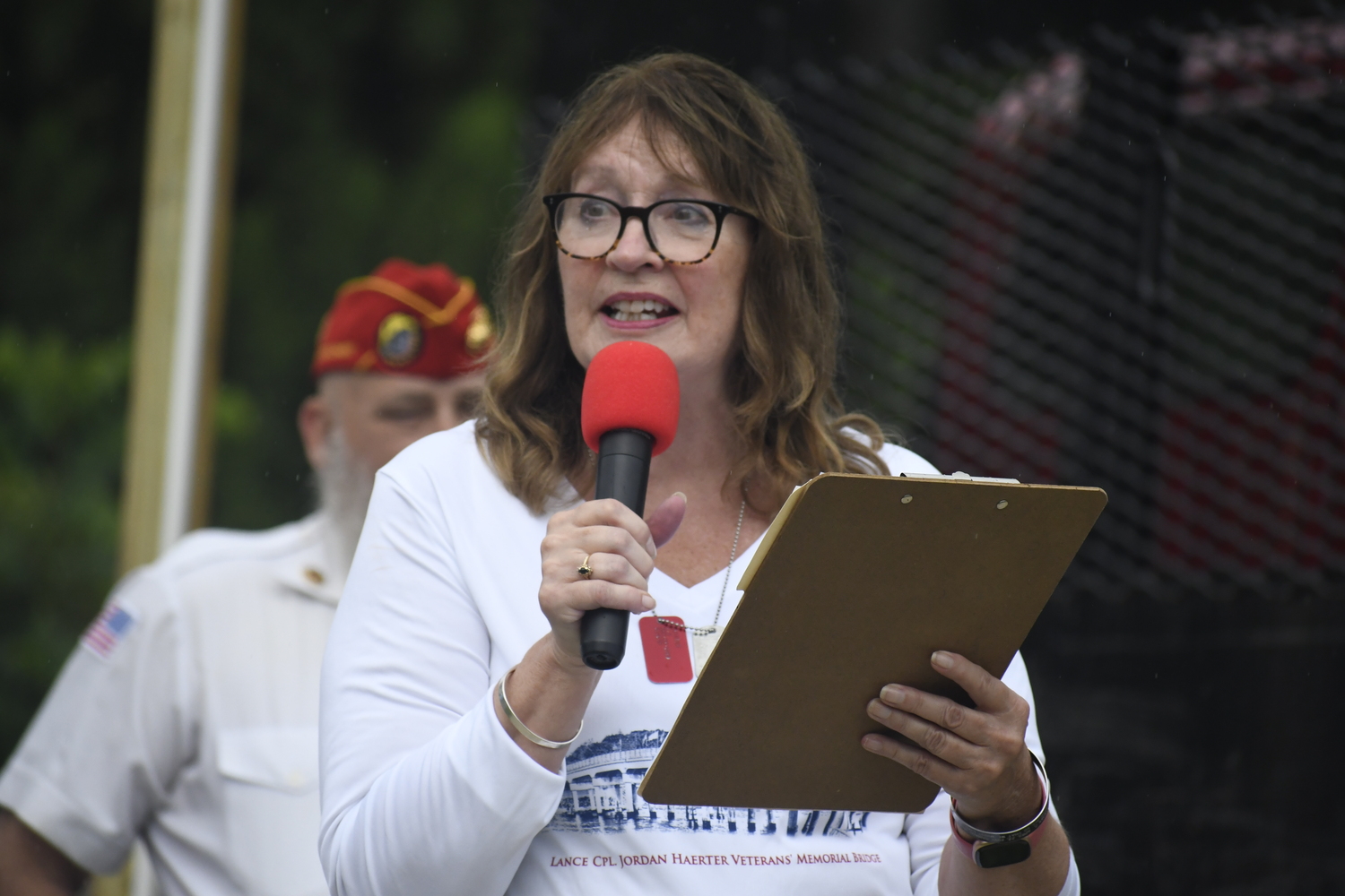 JoAnn Lyles, mother of Jordan Haerter, speaks prior to Sunday morning's race.  DREW BUDD