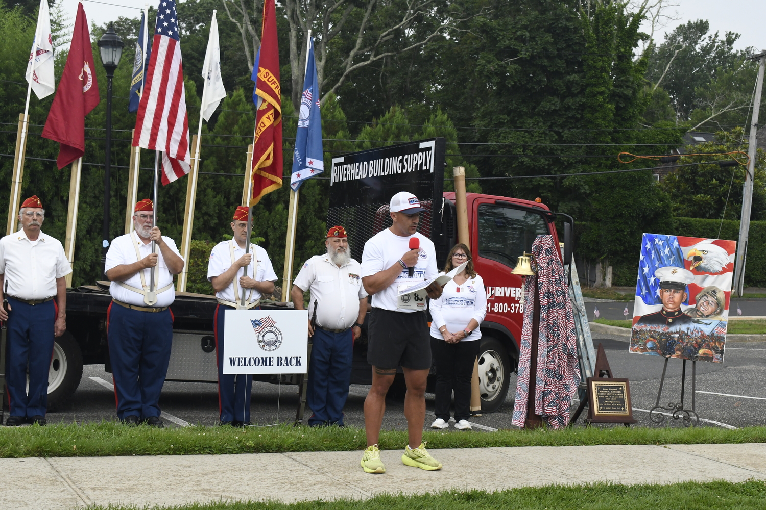 Christian Dominguez reads General John Kelly's quote, which was done prior to the race this year than in year's past when it was done after the race.  DREW BUDD