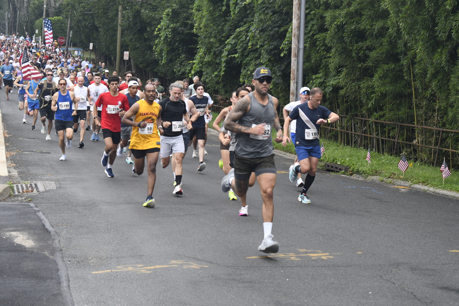 Neil Falkenhan leads the group of runners out onto the course.  DREW BUDD