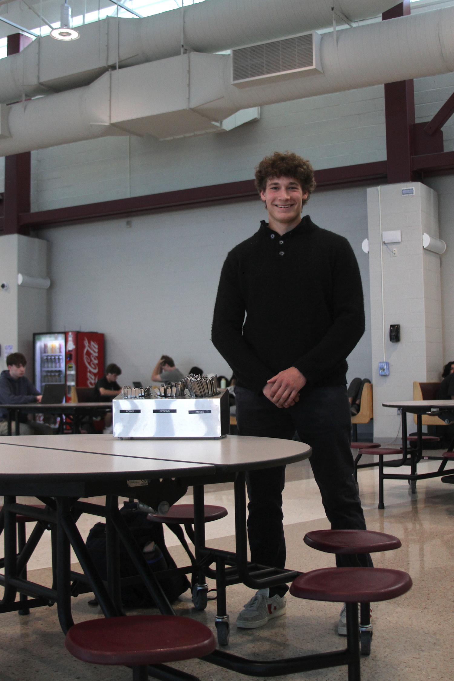 East Hampton junior Charlie Stern in the high school cafateria with his new metal silverware. DESIRÉE KEEGAN