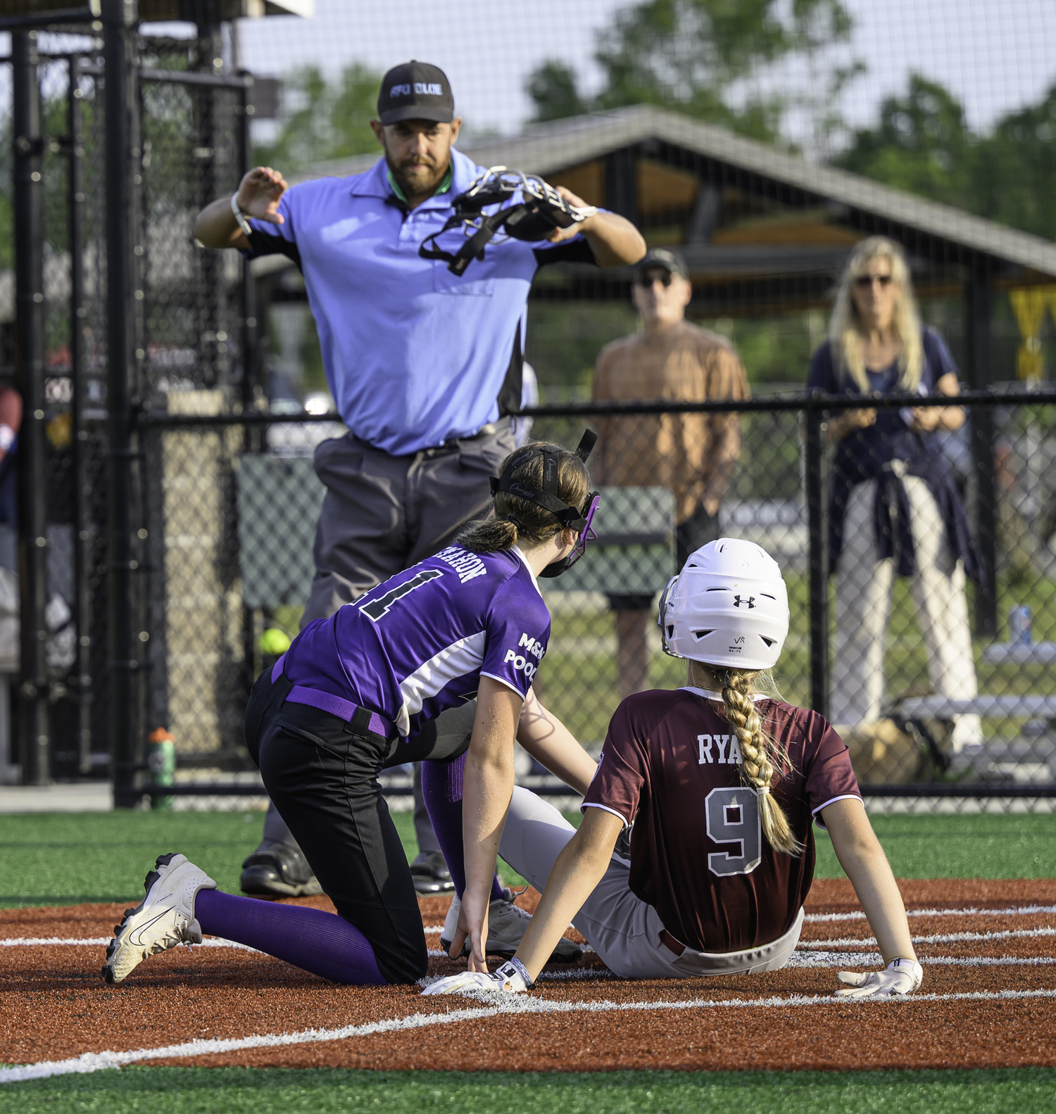 Vera Ryan slides into home plate safely.  MARIANNE BARNETT