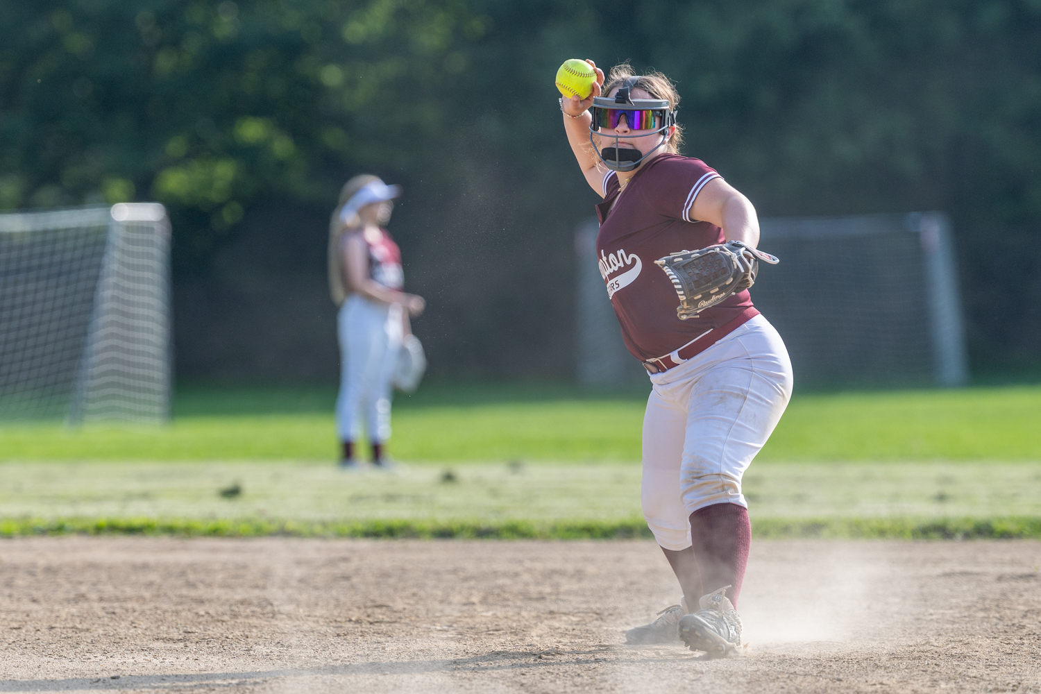 Lucia Galante looks to throw to first after fielding the ball.  RON ESPOSITO