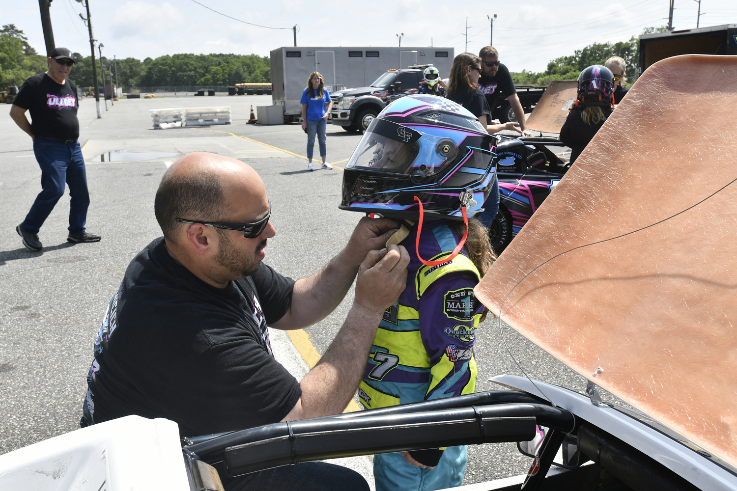 Scarlett Dumicich gets help with her helmet from her dad, Frank, Jr.  DANA SHAW
