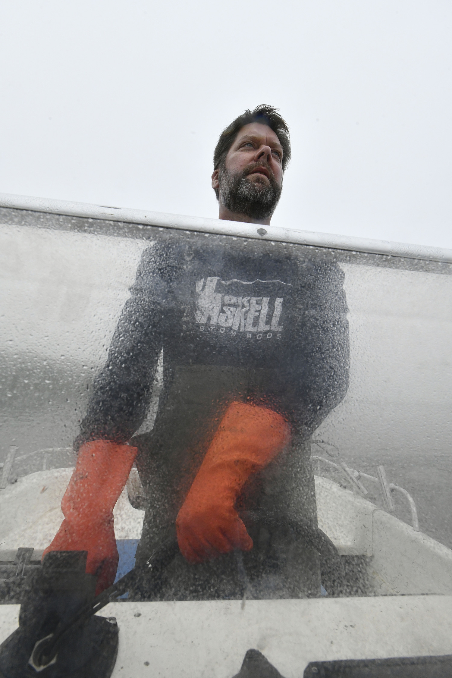 Captain Peter Haskell checks crab pots on Weesuck Creek on a foggy, misty day.  DANA SHAW