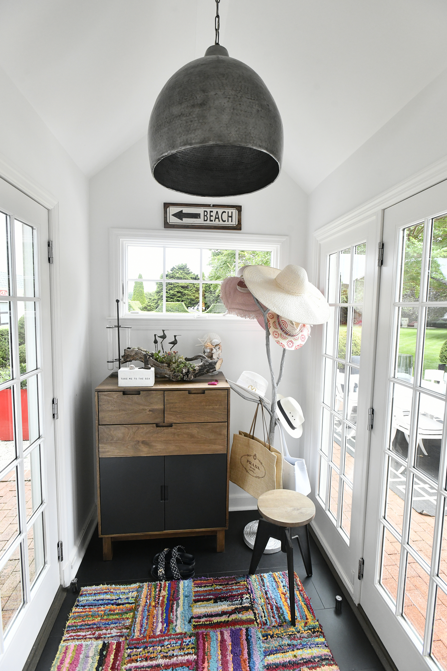 A small mudroom that heads to the back patio.  DANA SHAW