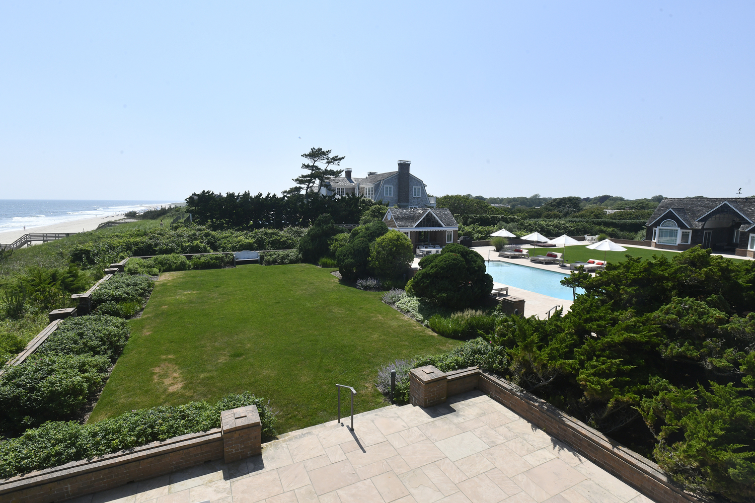 Looking out on the second floor deck onto the back patio and back lawn.  DANA SHAW