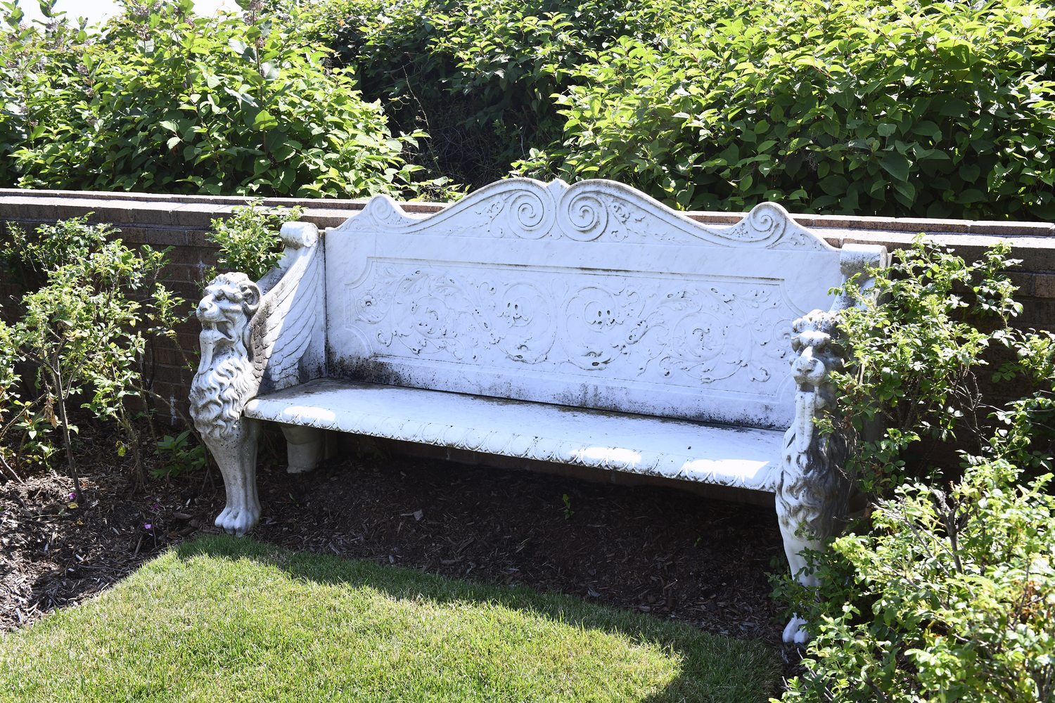 The marble bench original to the house occupies a prominent place in the back yard.   DANA SHAW