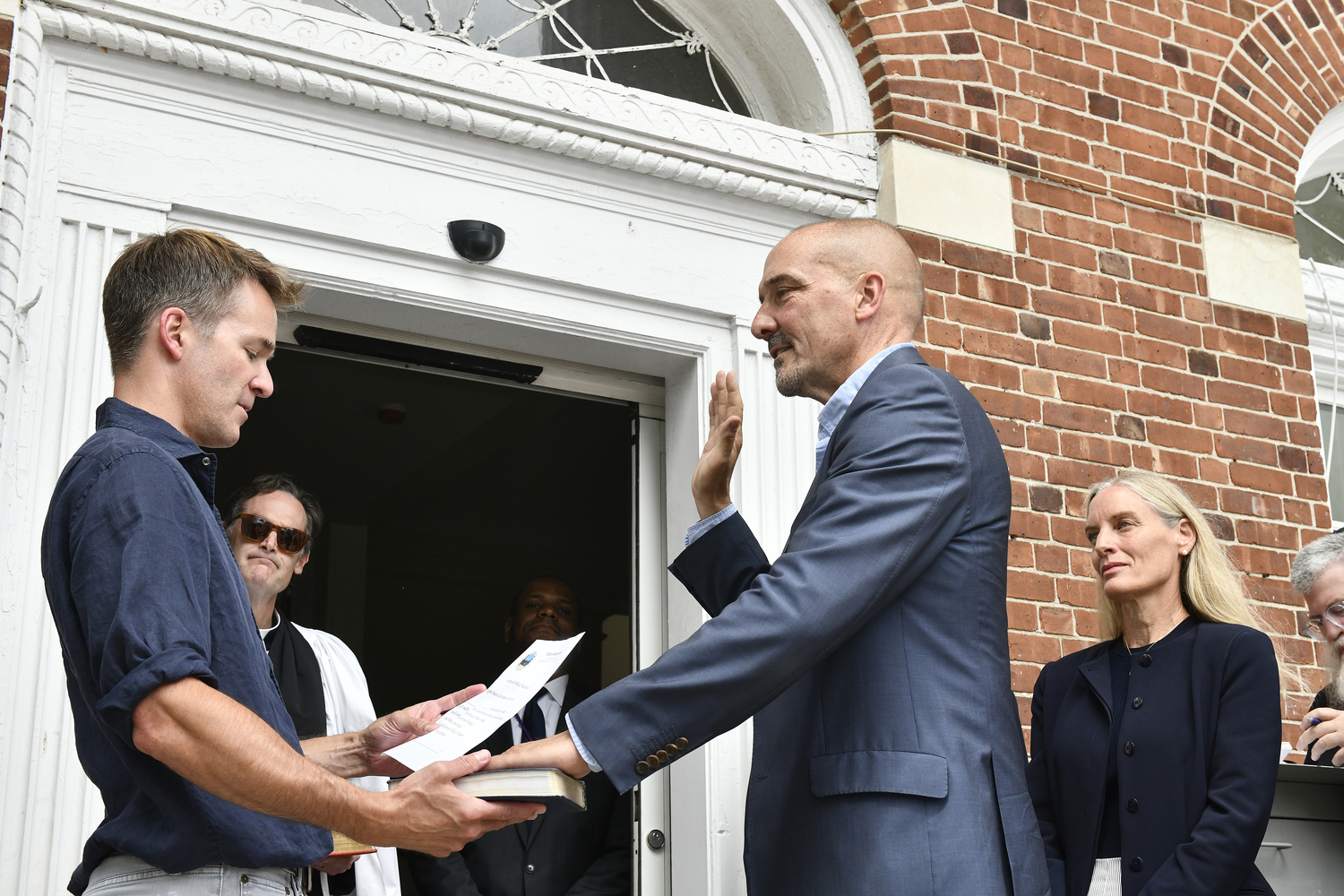 New village trustee Rob Coburn was sworn in by Averitt Buttry.  DANA SHAW