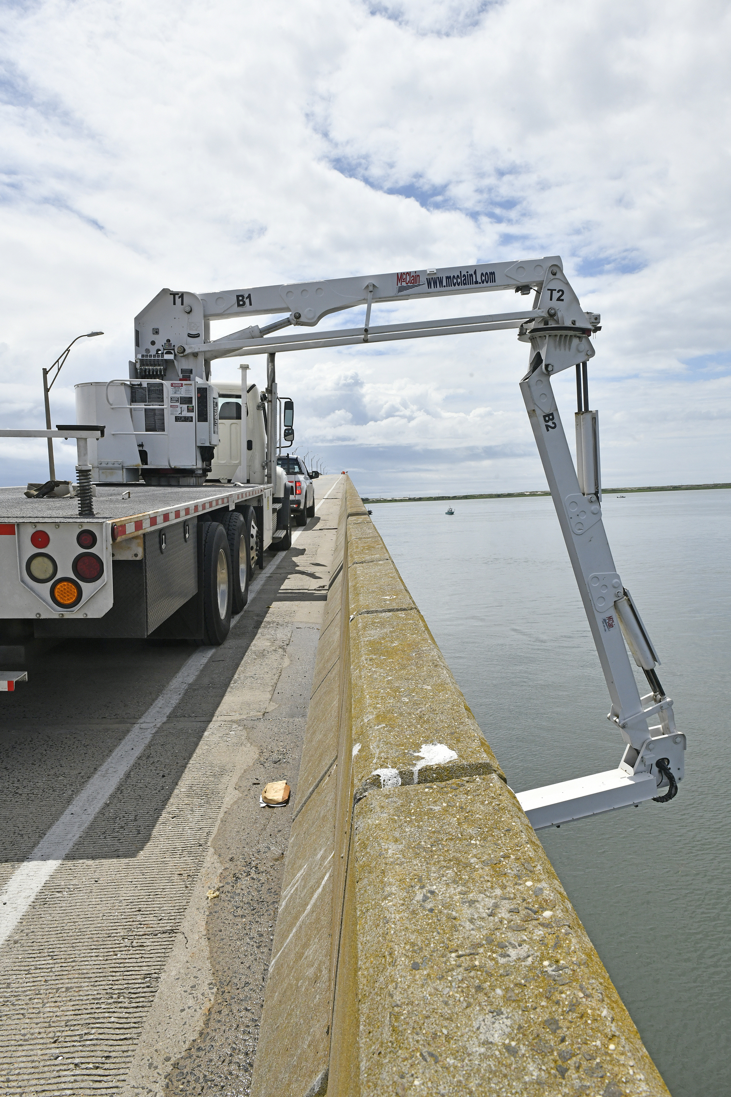 Engineers working for the Suffolk County Department of Public Works conduct a more forensic assessment on the Ponquogue Bridge on Tuesday. DANA SHAW