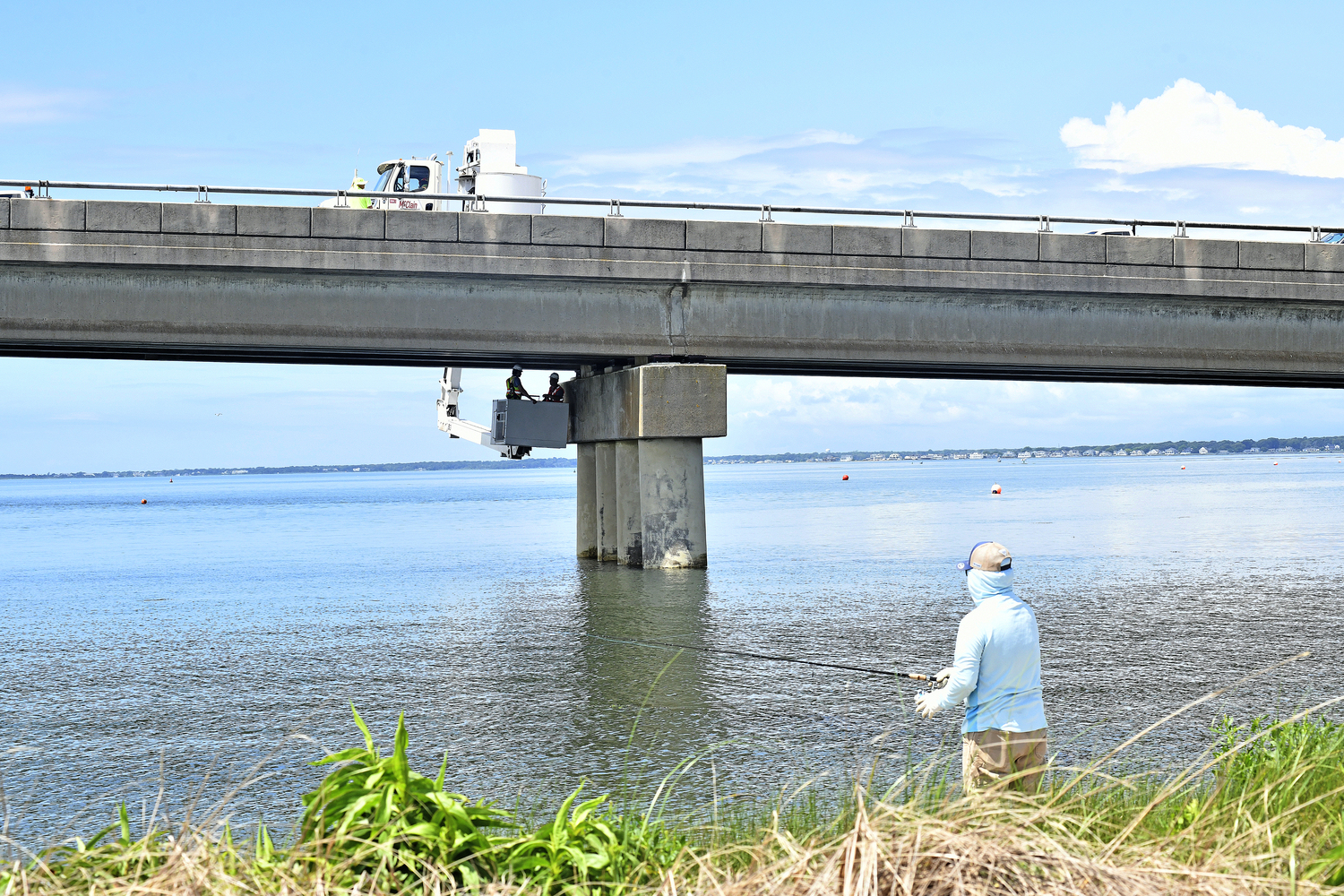Engineers working for the Suffolk County Department of Public Works conduct a more forensic assessment on the Ponquogue Bridge on Tuesday. DANA SHAW
