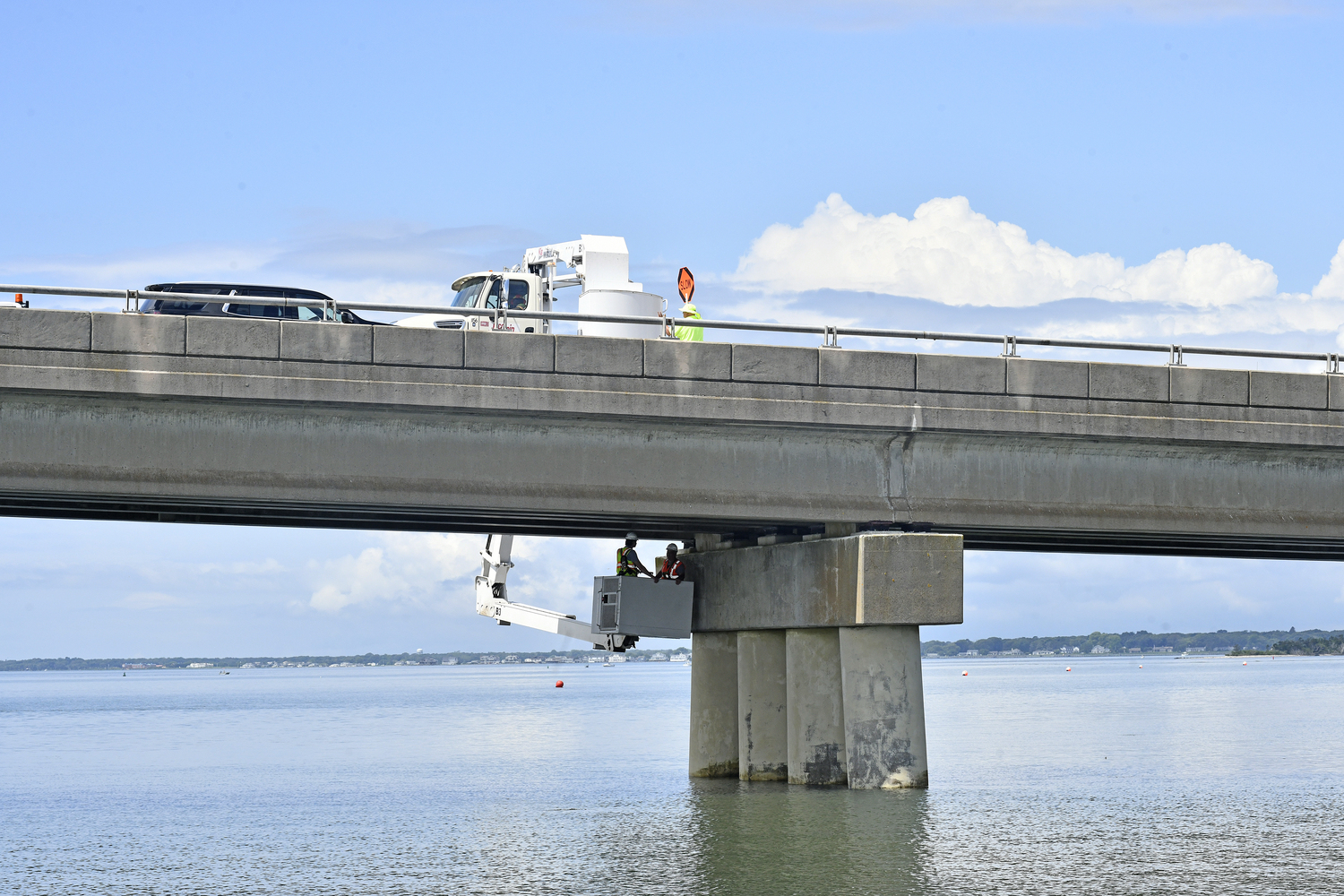 Engineers working for the Suffolk County Department of Public Works conduct a more forensic assessment on the Ponquogue Bridge on Tuesday. DANA SHAW