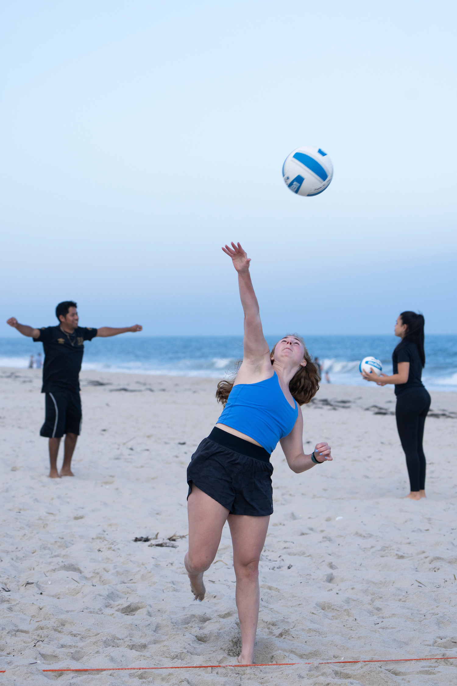 The 12 volleyball courts at Tiana Beach in Hampton Bays are packed on Tuesday and Thursday nights for leagues organized by East End Volleyball, which is on the cusp of its 50th anniversary. LORI HAWKINS