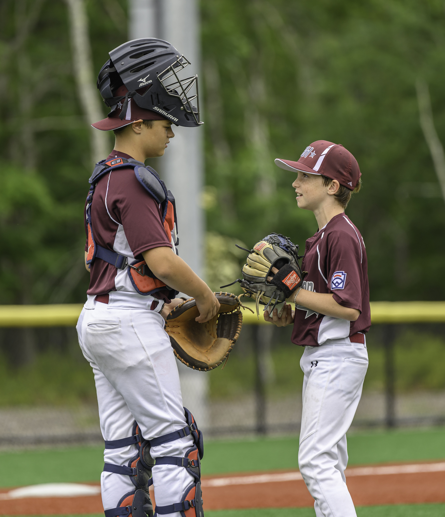 Catcher Griffin Page and pitcher A.J. Gosman discuss things.  MARIANNE BARNETT