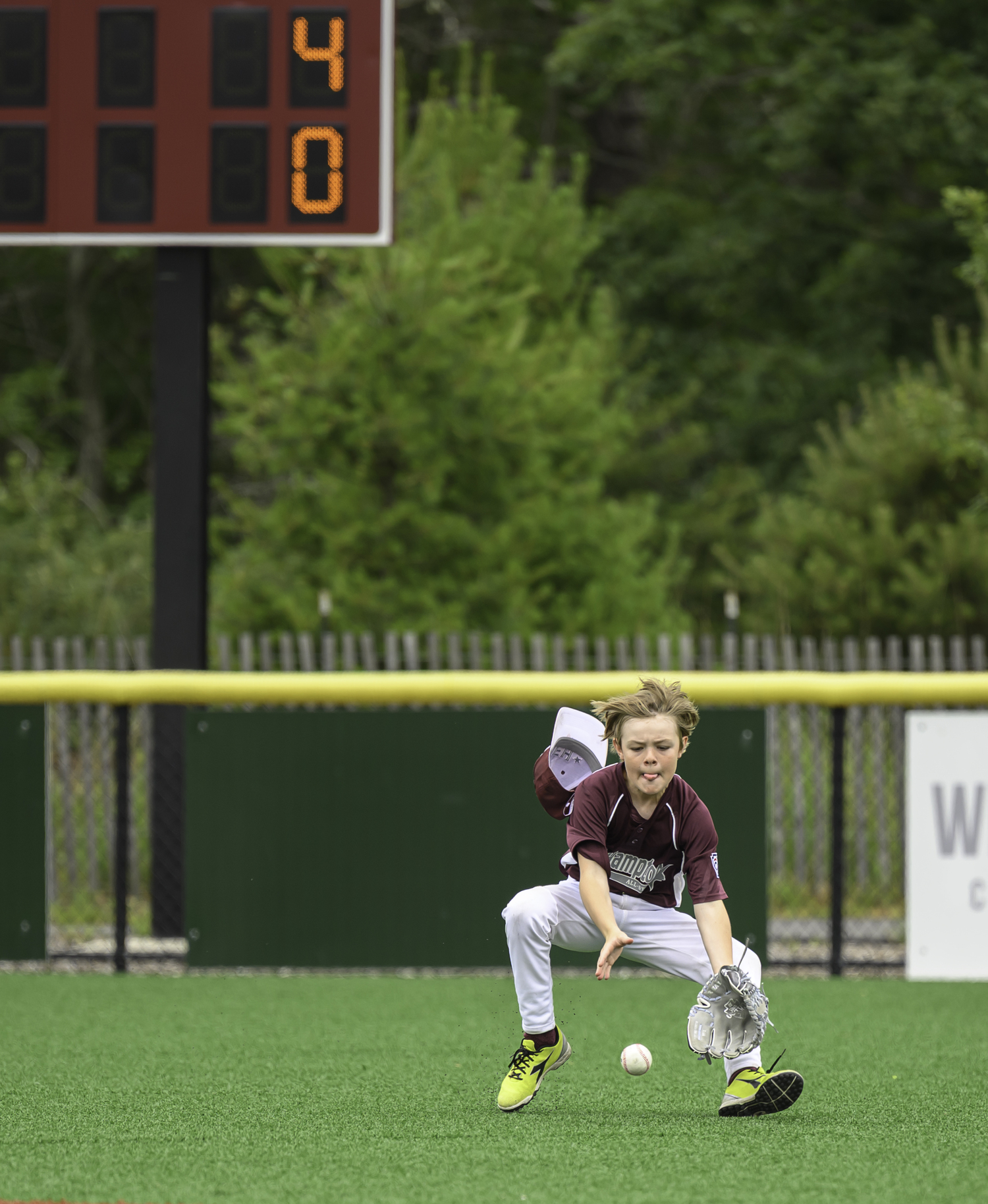 Dixon Bennett fields the ball in the outfield. MARIANNE BARNETT