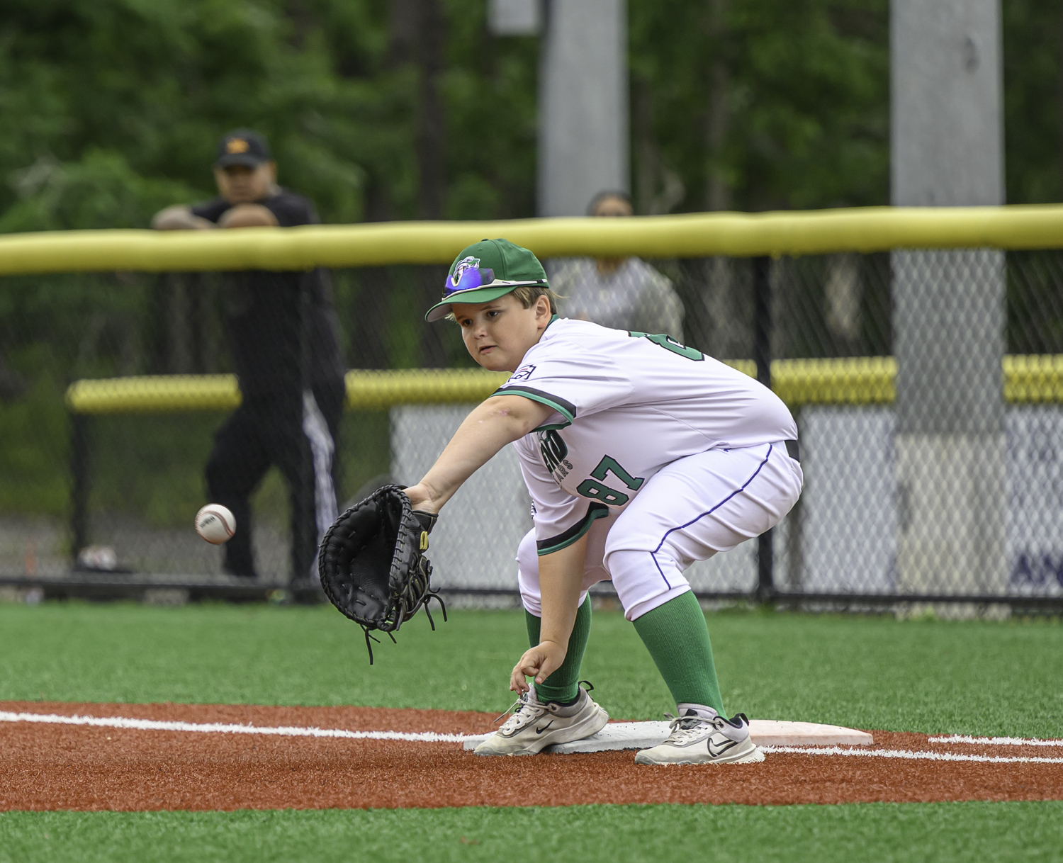 Tucker Collins is there for the out at first base.  MARIANNE BARNETT