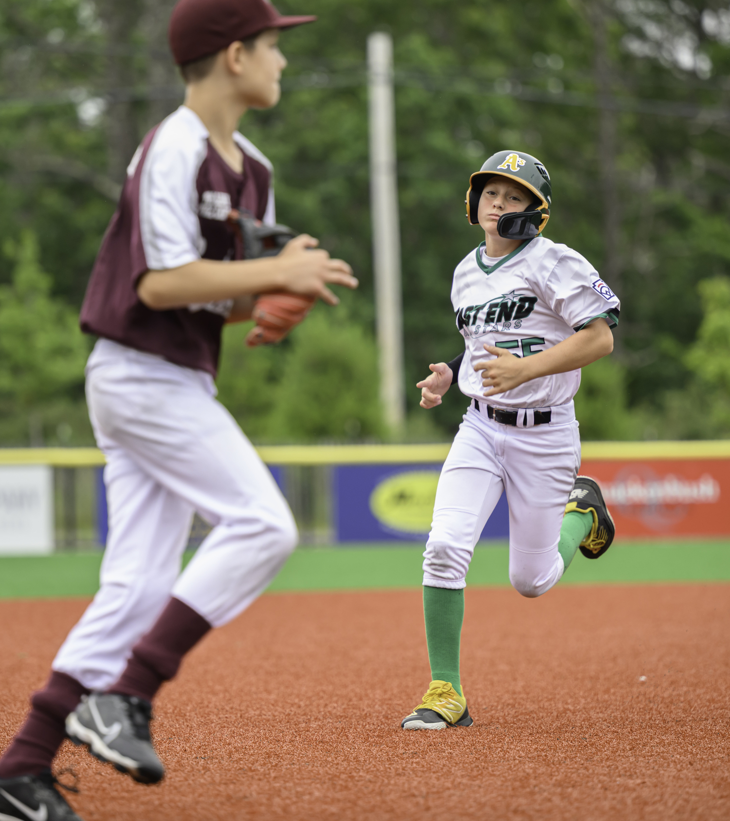 Ben Cariello heads to third base.  MARIANNE BARNETT