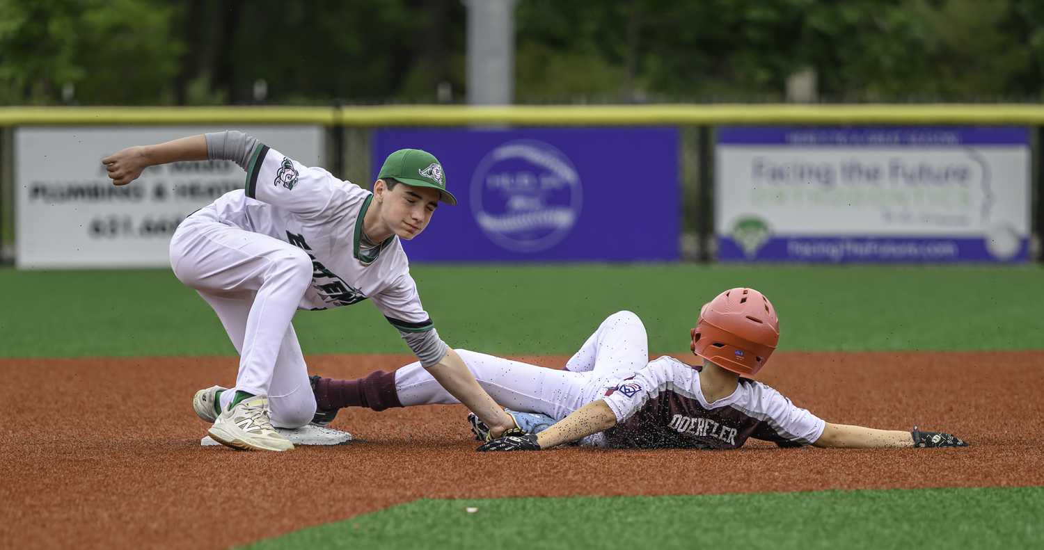 East End's Gabe Dawson tags out Southampton's Rex Doerfler at second base.  MARIANNE BARNETT
