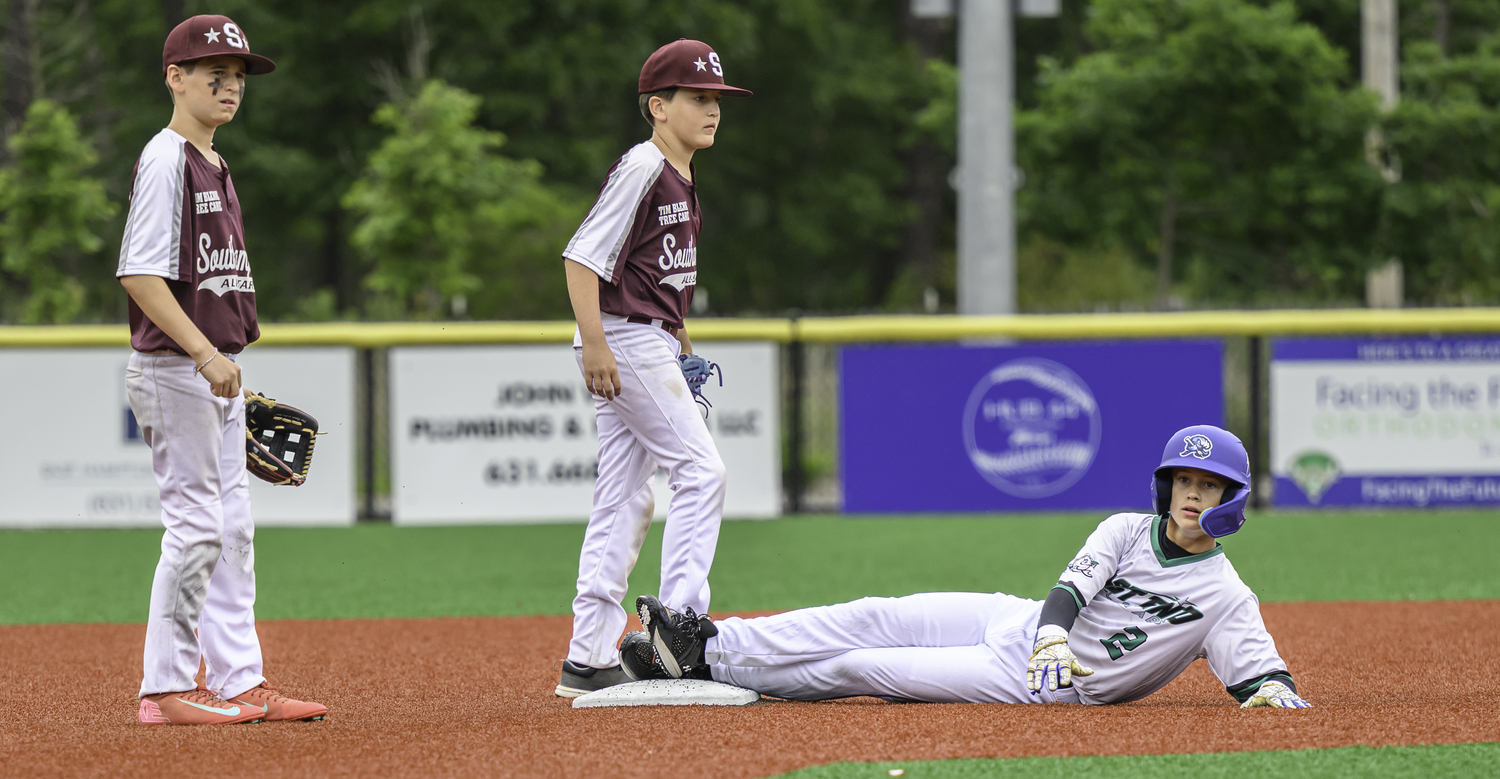 Matthew Neumaier slides into second base.  MARIANNE BARNETT