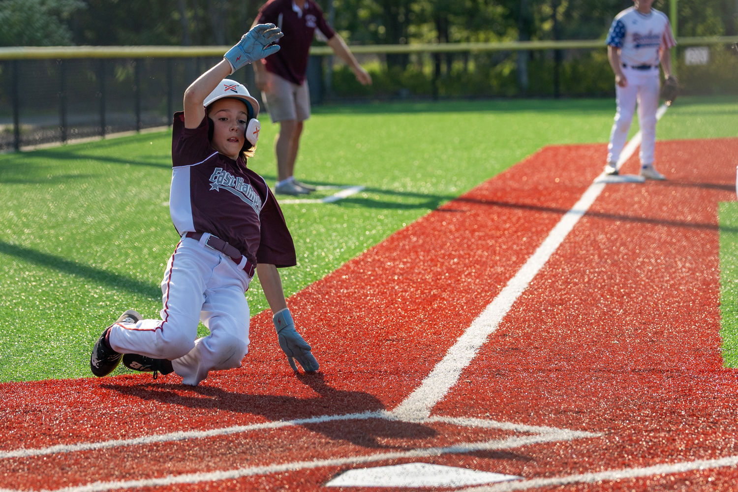 Luca Cereda slides into home plate. RON ESPOSITO
