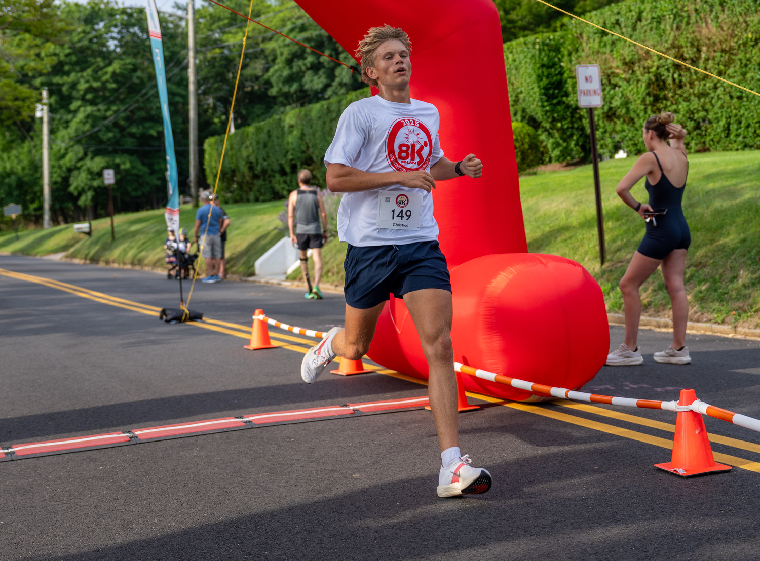 Christian Duggal of Southampton placed third overall in the 8K.  RON ESPOSITO