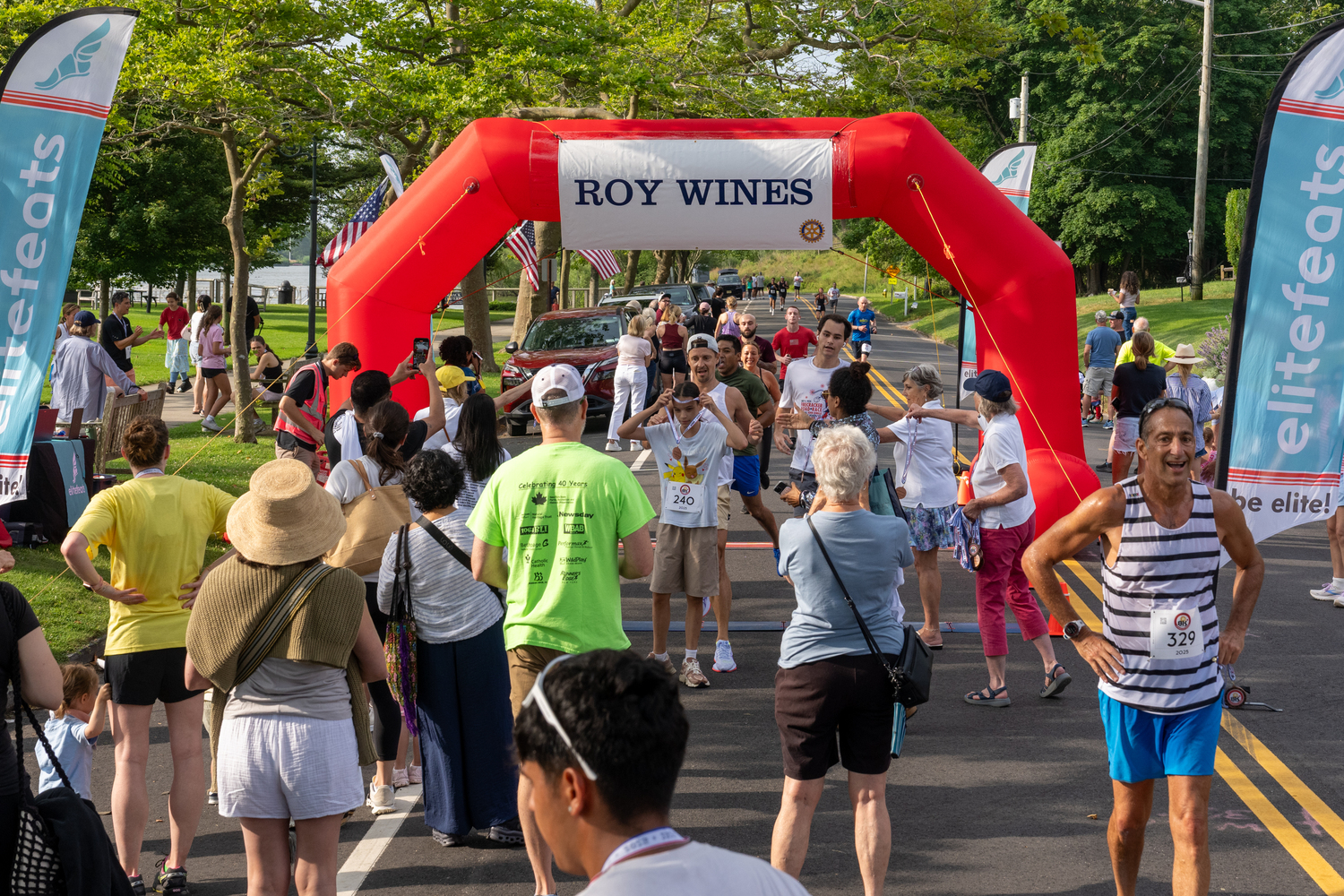 There's a lot going on at the finish line as runners are still coming in and getting their medals and friends and family await for their loved ones to come in.  RON ESPOSITO