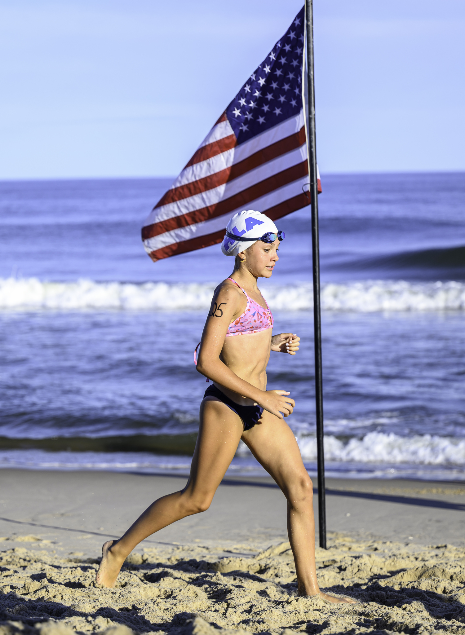 Evelyn Rizzo crosses the finish line.  MARIANNE BARNETT