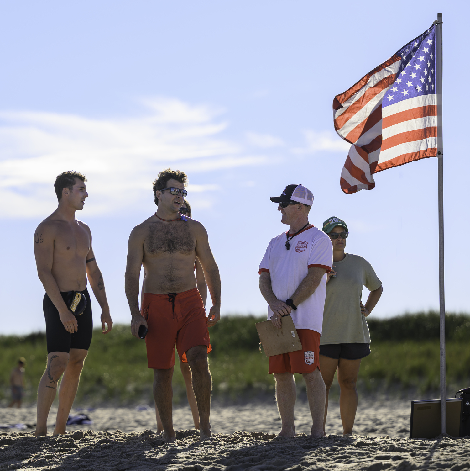 HLA officials and participants discuss Friday's Run-Swim-Run before the start.  MARIANN BARNETT