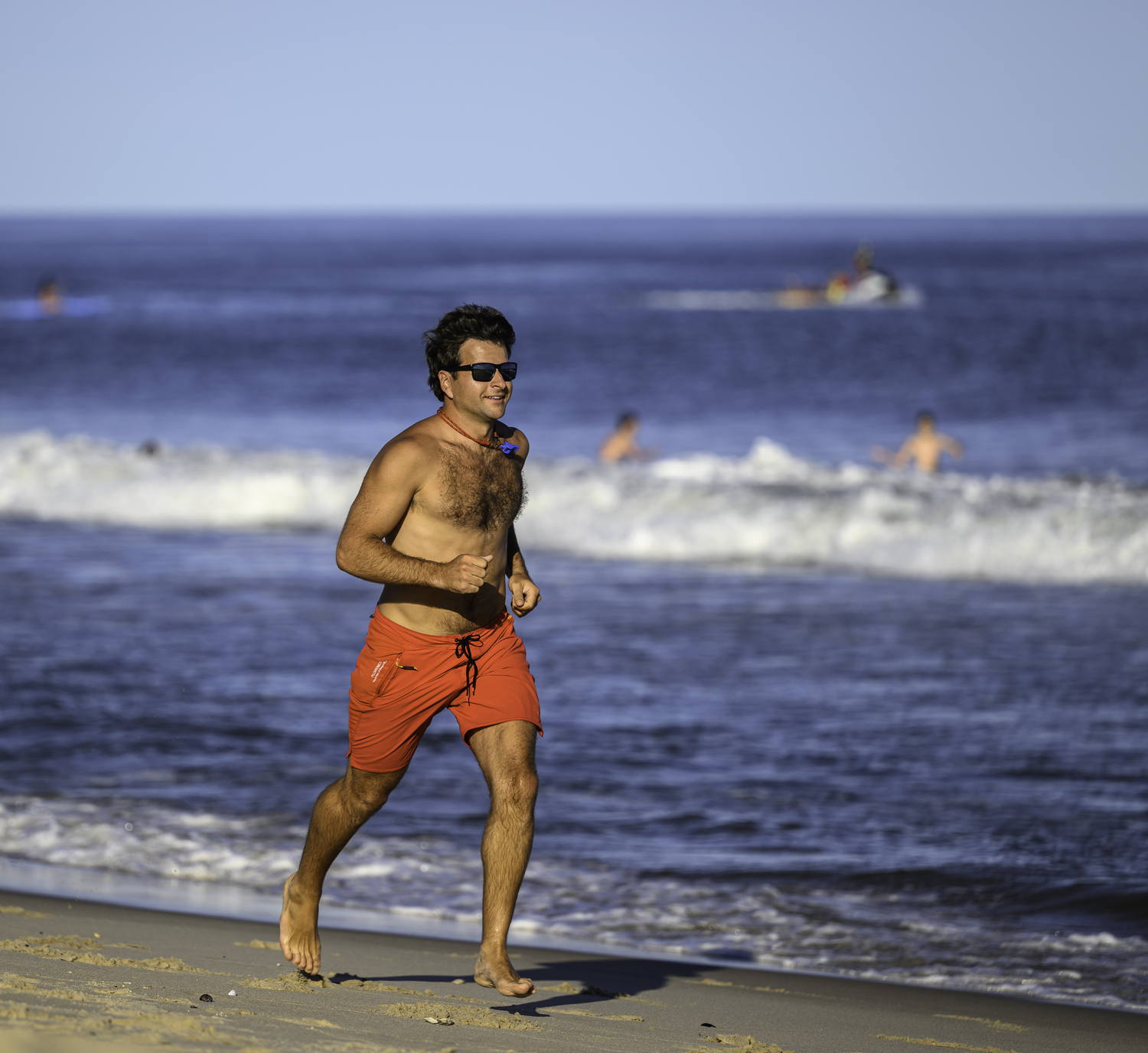 A participant runs along the shore at Atlantic Avenue Beach in Amagansett on Friday.  MARIANNE BARNETT