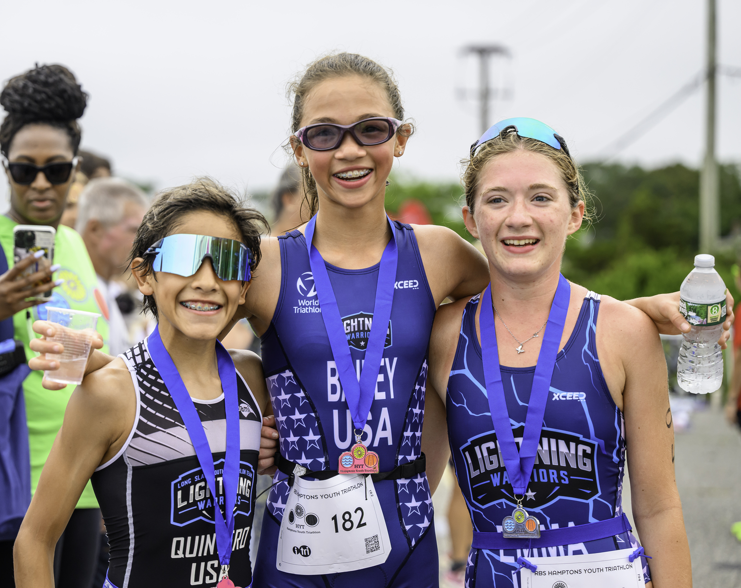 Overall champion Esteban Quintero, left, first overall girl Catherine Bailey and third place girl Emma Leary.  MARIANNE BARNETT