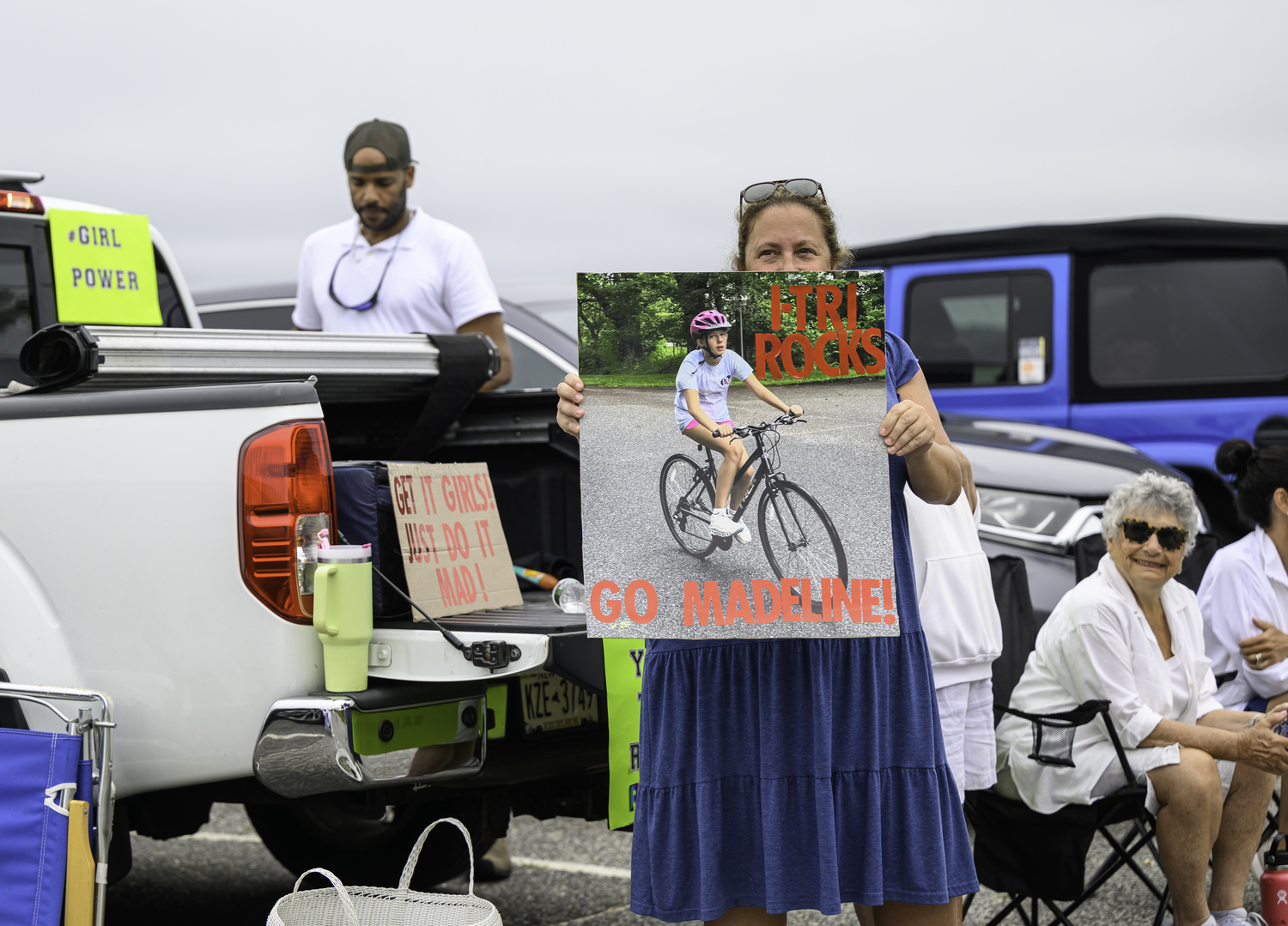 Madeline Frederic supporters at the race. Nearly 1,000 people lined up to support the those competing in the Hamptons Youth Triathlon on Saturday morning at Long Beach.  MARIANNE BARNETT