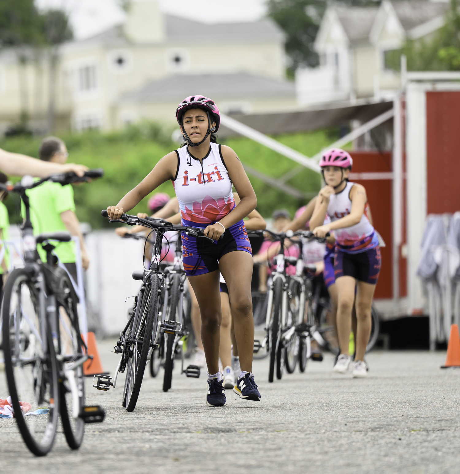 i-Triathletes make the transition from the run to the bike portion of the race.  MARIANNE BARNETT