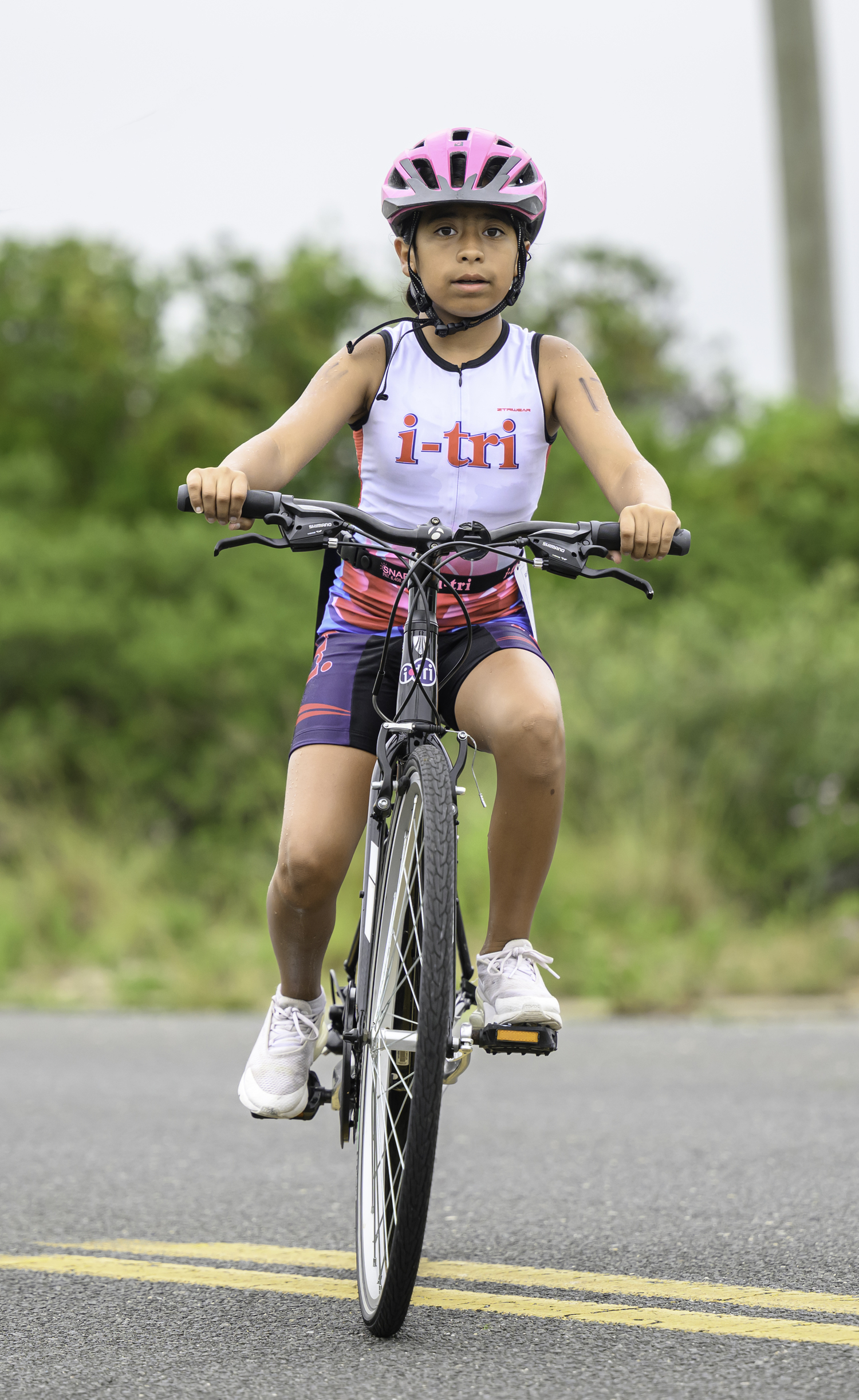 Zoha Asif of Shirley heads out on the bike portion of the race.  MARIANNE BARNETT