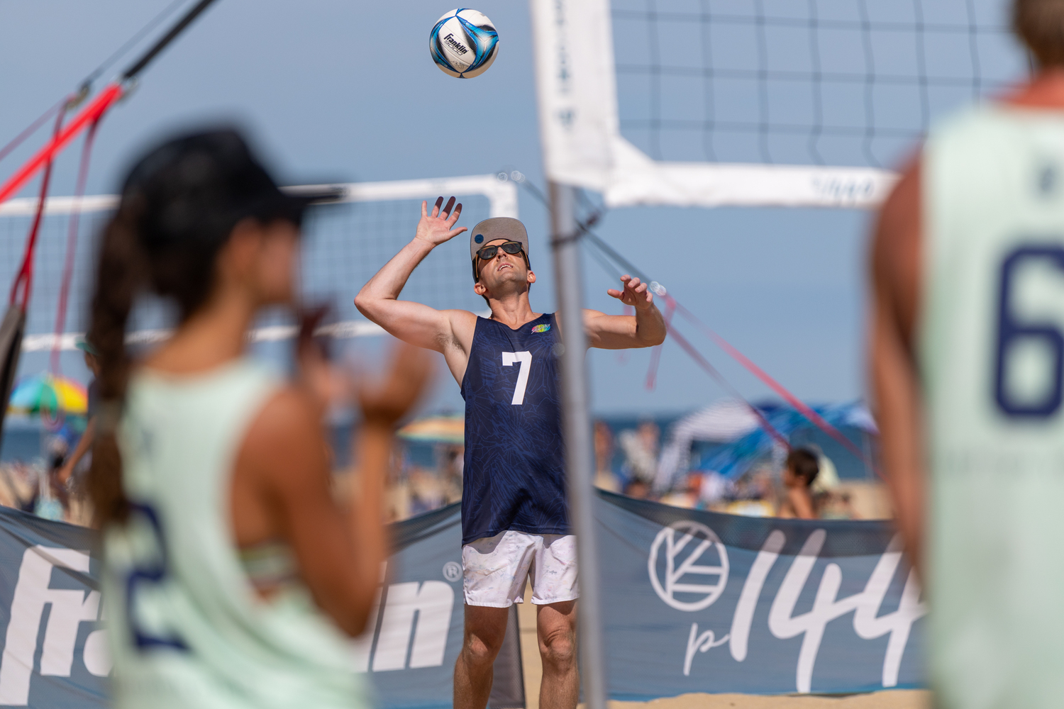 John Sutton flips the ball up to serve.  RON ESPOSITO