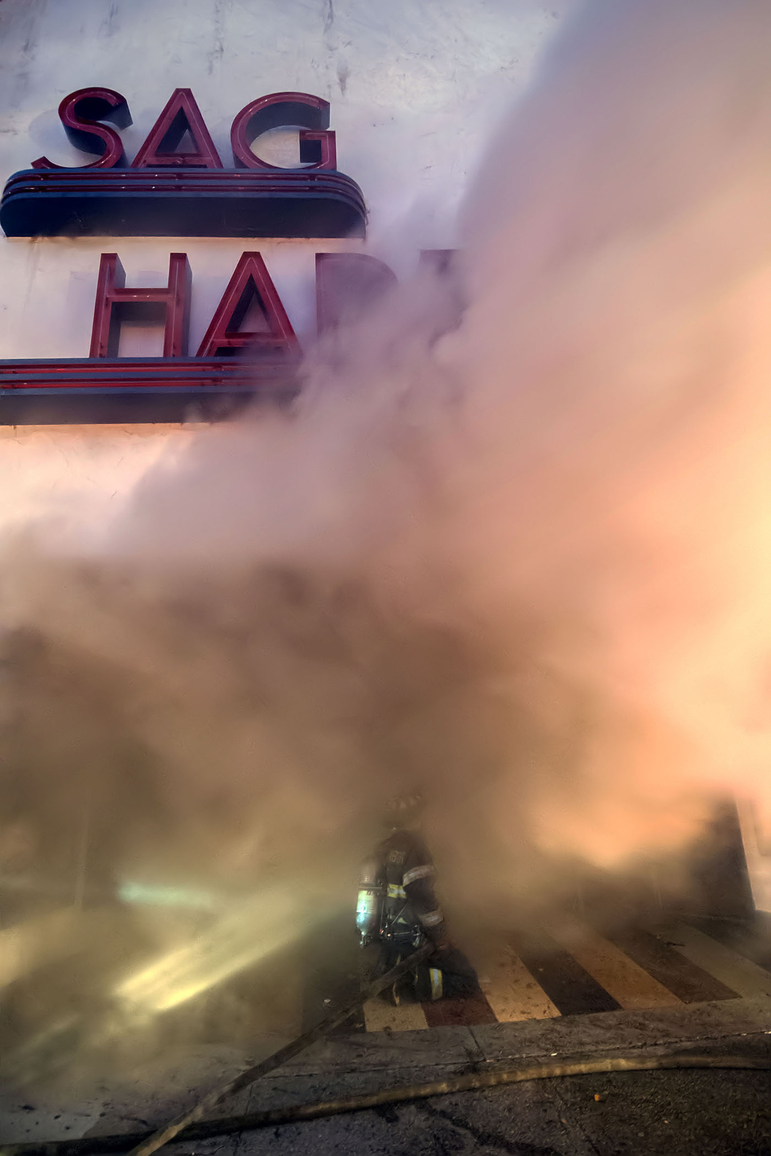 On December 16, 2016 at 6:11 a.m., the Sag Harbor Fire Department was called to 78 Main Street for a report of a deck fire at the rear of the building. Arriving units found a working fire that had begun to extend into the Sag Harbor Cinema and adjacent buildings, and immediately called for mutual aid from neighboring fire departments. Fueled by icy conditions and strong winds, the fire ended up requiring the help of 16 fire departments and 3 EMS agencies from across the east end of Long Island, as well as resources from Suffolk County Fire and Rescue services. Fortunately there were no injuries.   MICHAEL HELLER