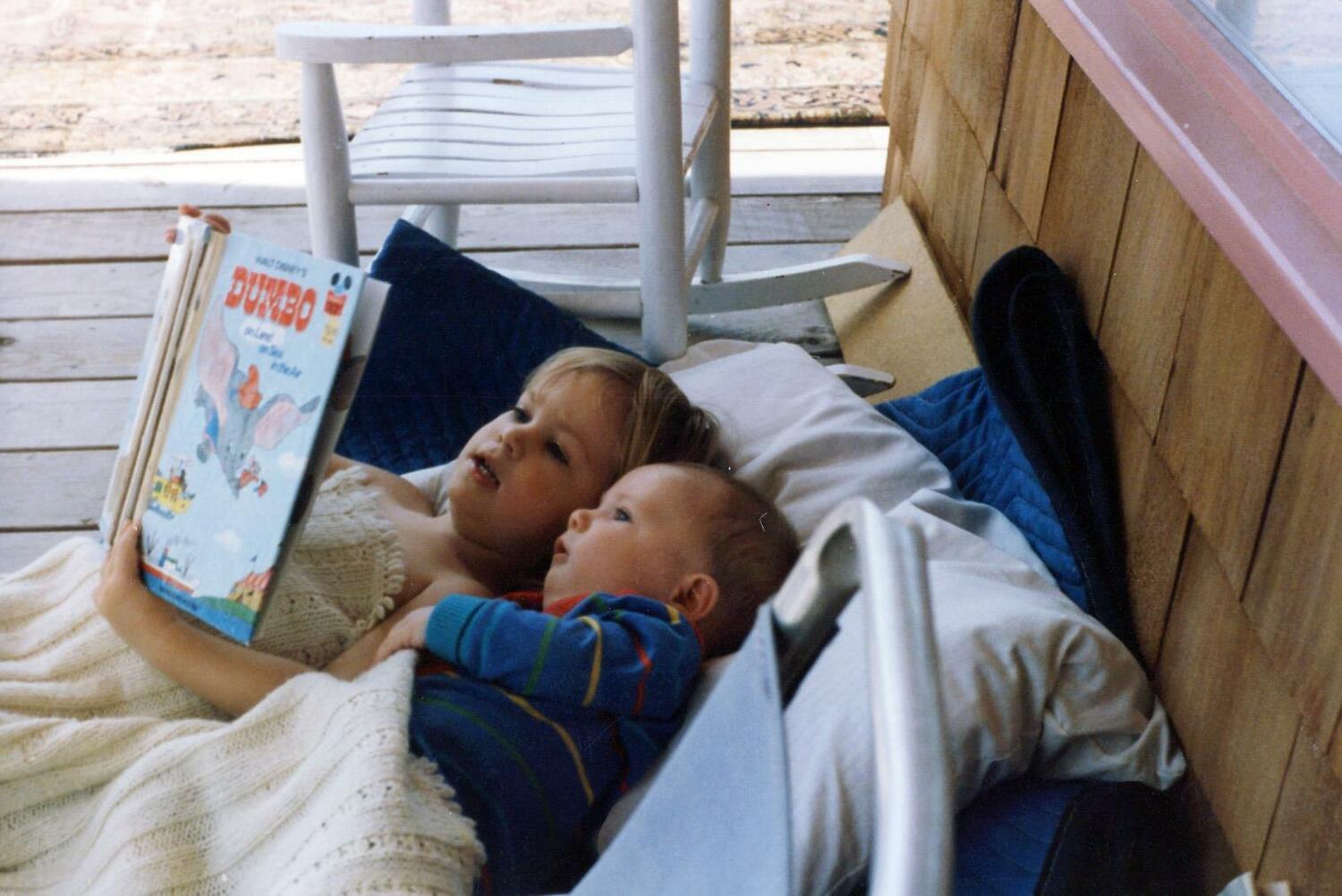 Hope Reese and her brother, Alexander, read together on the porch. COURTESY HOPE REESE