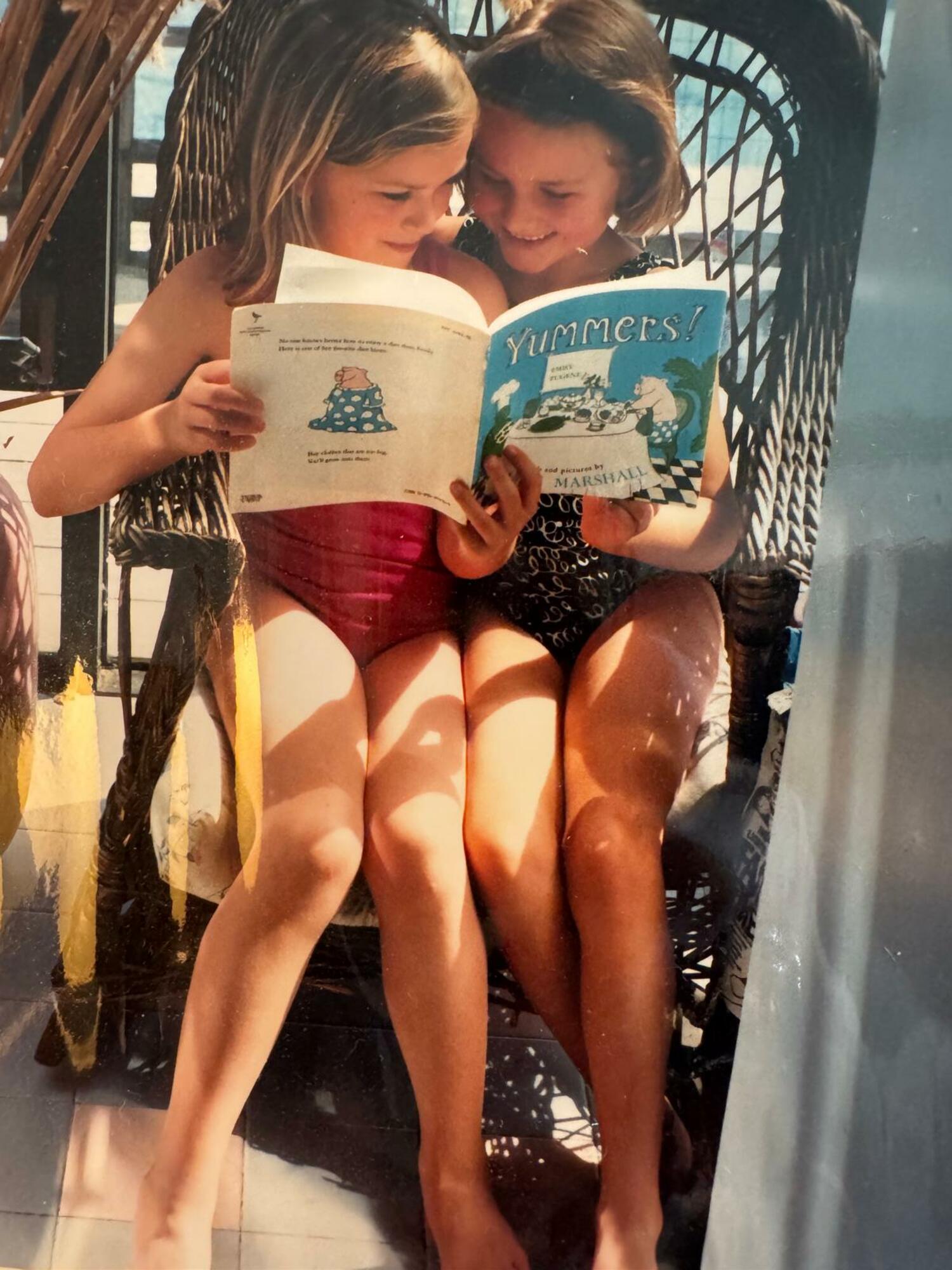 Hope Reese and her friend, Lizzi Bickford, read together. COURTESY HOPE REESE