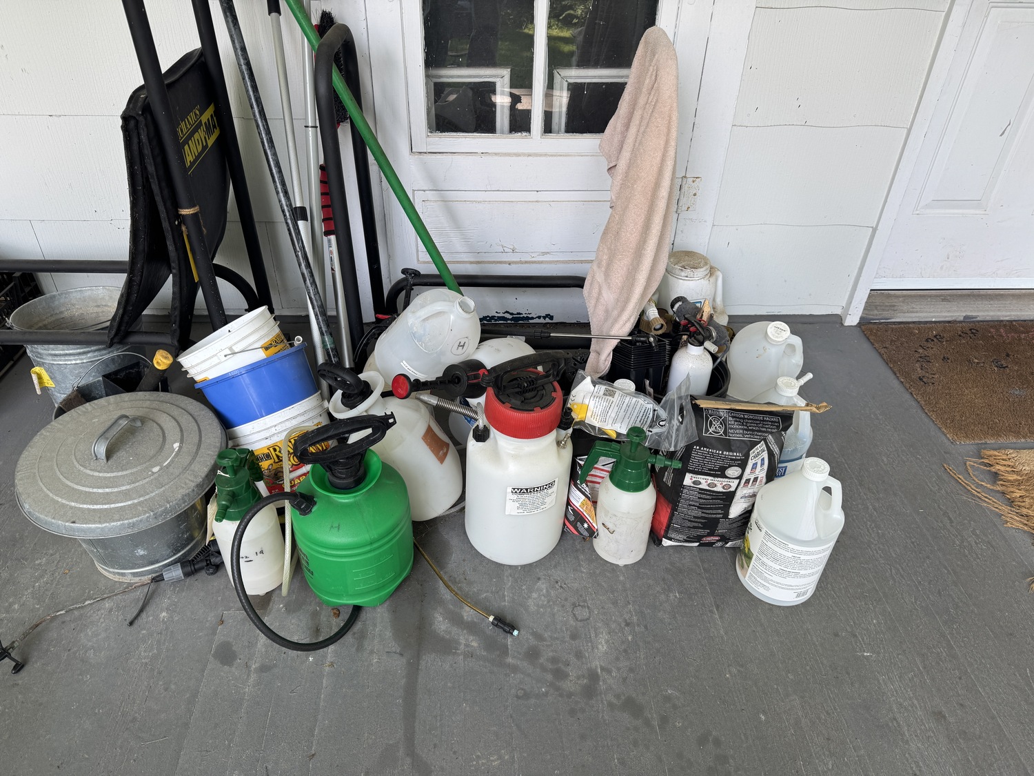 My collection of sprayers that will be retired any minute. Only one of these sprayers has a pressure relief valve, which is a safety must to protect the user from accidental sprays in the face when removing the plunger assembly. ANDREW MESSINGER