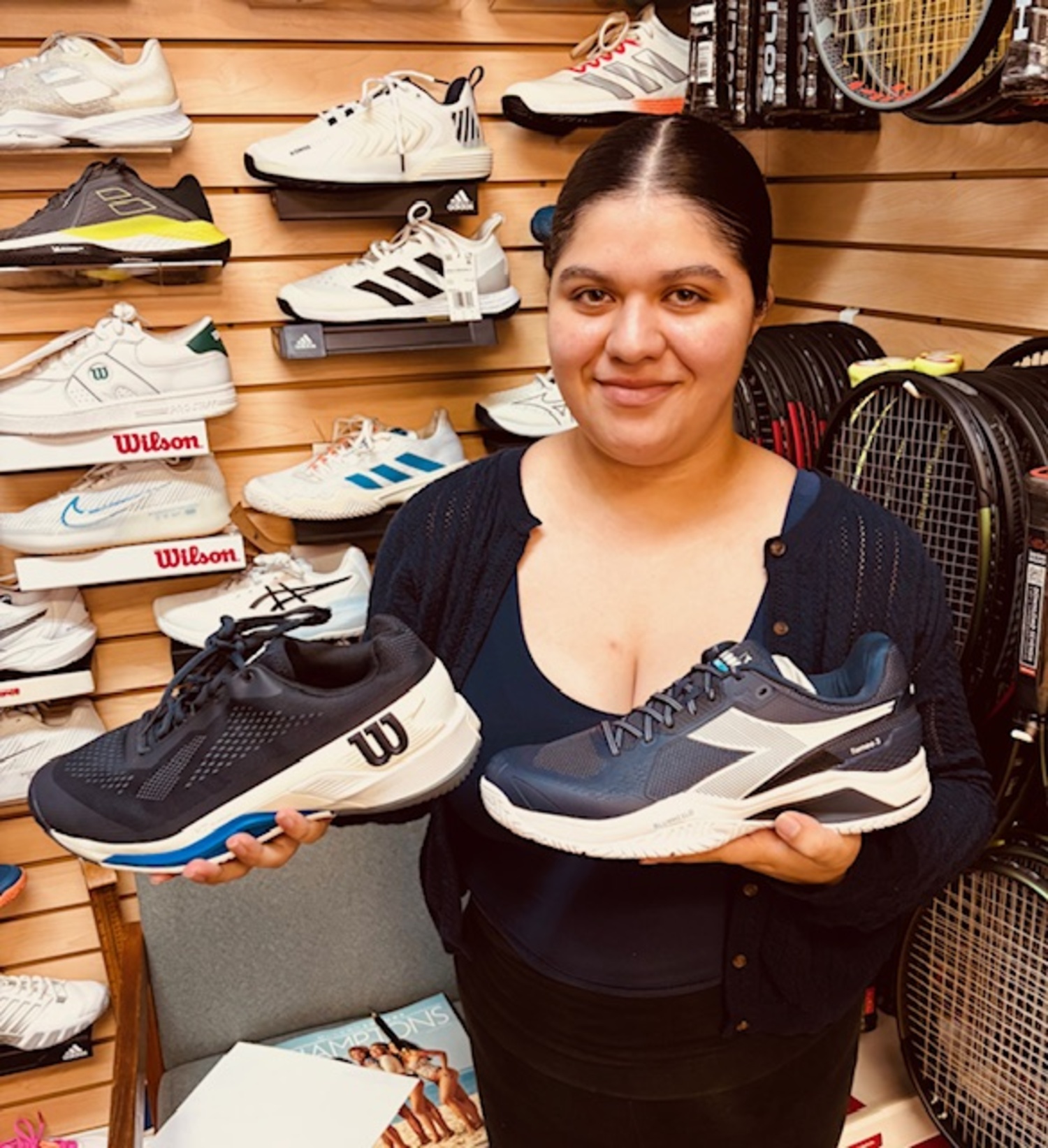 Amy Santos shows off a pair of court shoes.